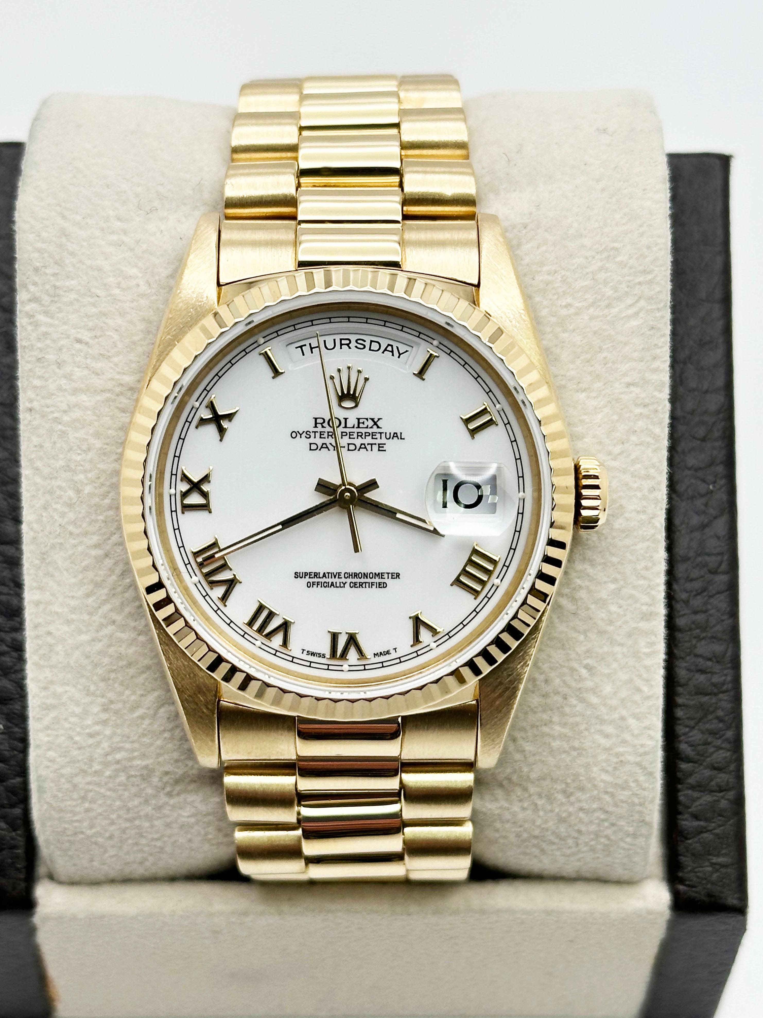 Style Number: 18238
Serial: W544***
Year: 1995
Model: President Day Date Double Quickest
Case Material: 18K Yellow Gold 
Band: 18K Yellow Gold 
Bezel: 18K Yellow Gold 
Dial: White Enamel Roman Numerals 
Face: Sapphire Crystal 
Case Size: