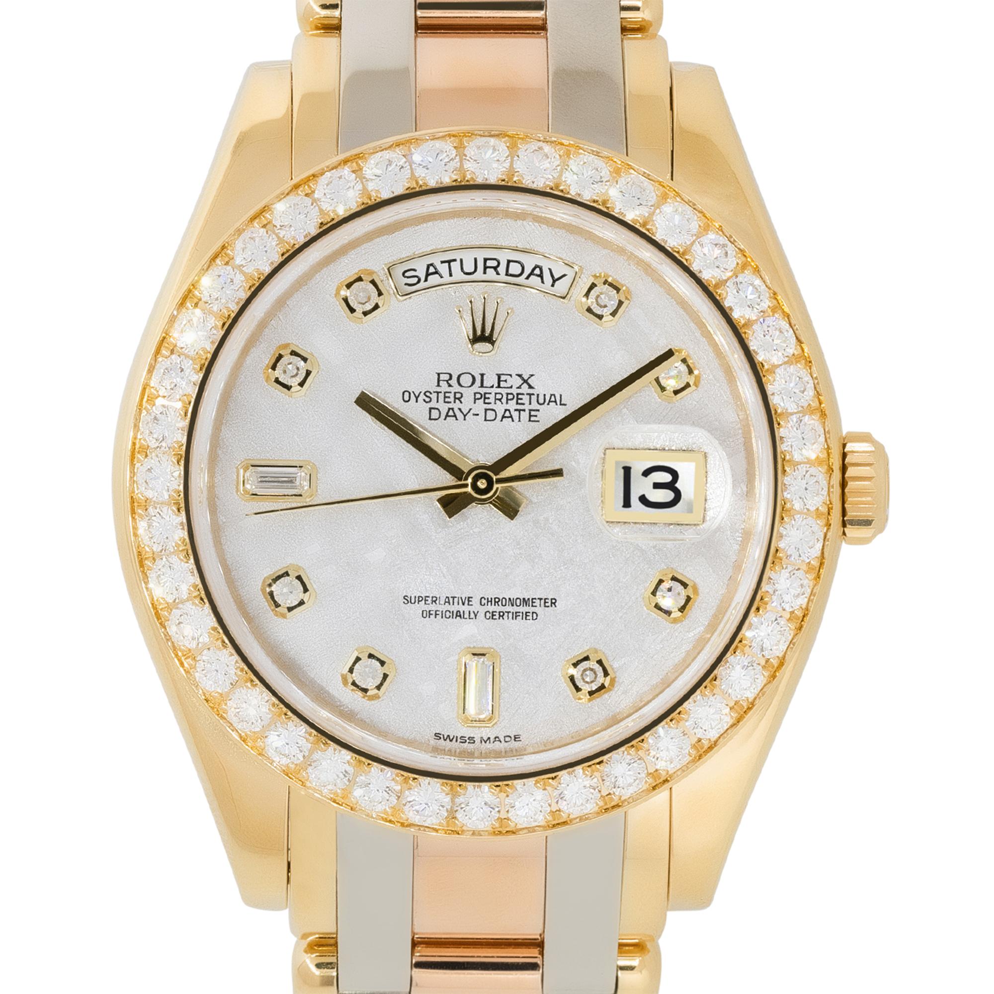 Brand: Rolex
Case Material: 18k White, Yellow and Rose gold
Case Diameter: 39mm
Crystal: Sapphire Crystal
Bezel: 18k Yellow Gold bezel with Diamonds
Dial: Meteorite Dial with yellow gold hands and Diamond hour markers. Date can be found at 3 o'clock