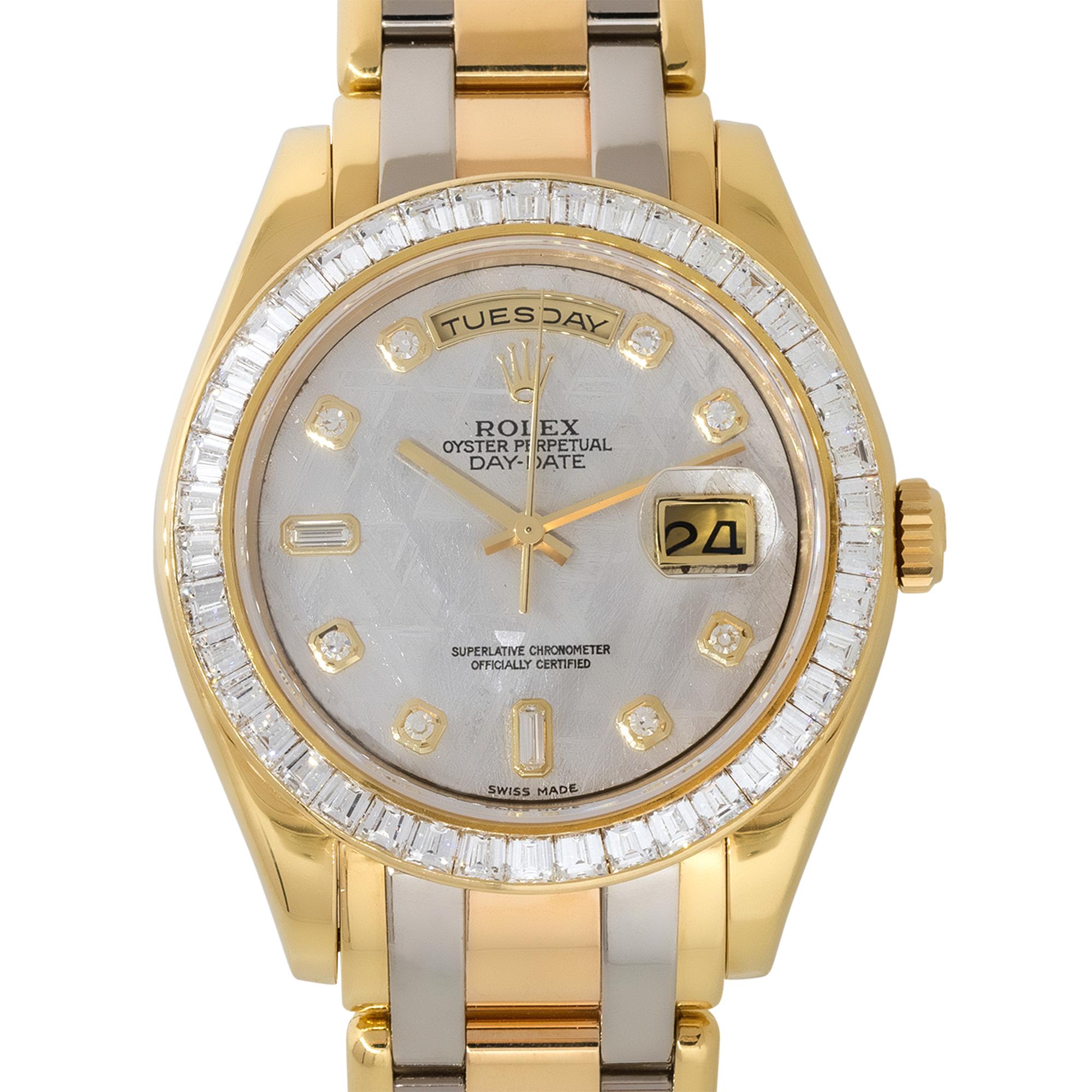 Brand: Rolex
Case Material: 18k White, Yellow and Rose gold
Case Diameter: 39mm
Crystal: Sapphire Crystal
Bezel: 18k Yellow Gold bezel with Diamonds
Dial: Meteorite Dial with yellow gold hands and Diamond hour markers. Date can be found at 3