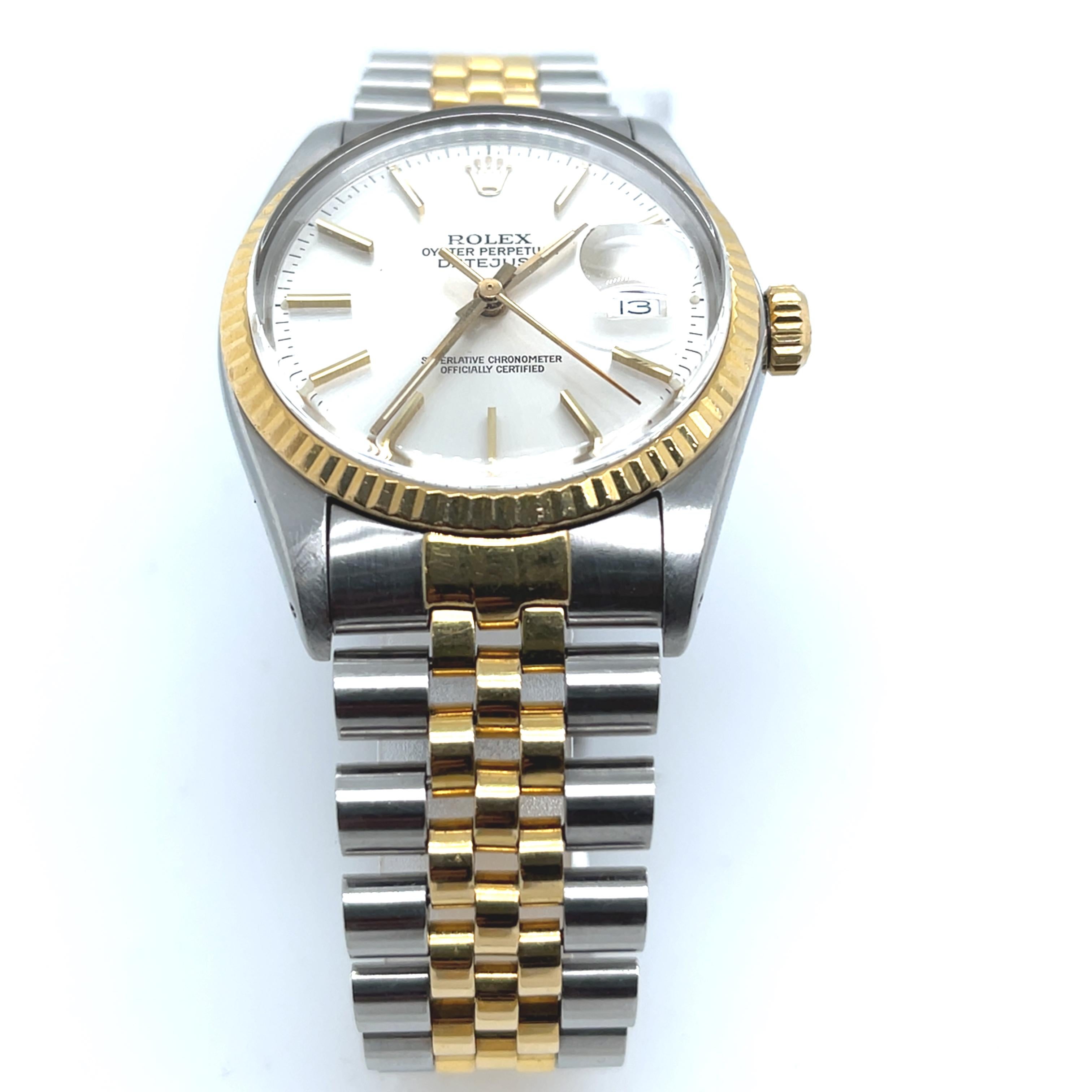 This classic Rolex Datejust men's wristwatch combines elegance with versatility, crafted in luxurious 18ct yellow gold and durable stainless steel. Model 62523H features Rolex’s iconic design with a gold fluted bezel and a date display, blending