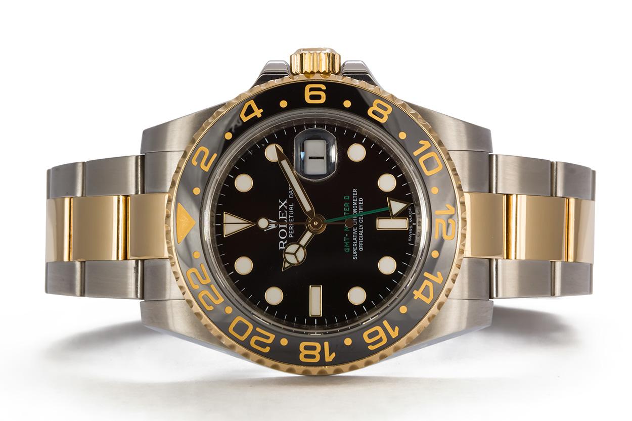 We are pleased to offer this 2008 Rolex GMT Master II 18k Gold & Stainless Steel 116710. It features a 40mm stainless steel case with black dial, 18k yellow gold bezel with black ceramic GMT insert, engraved inner bezel, stainless steel and 18k