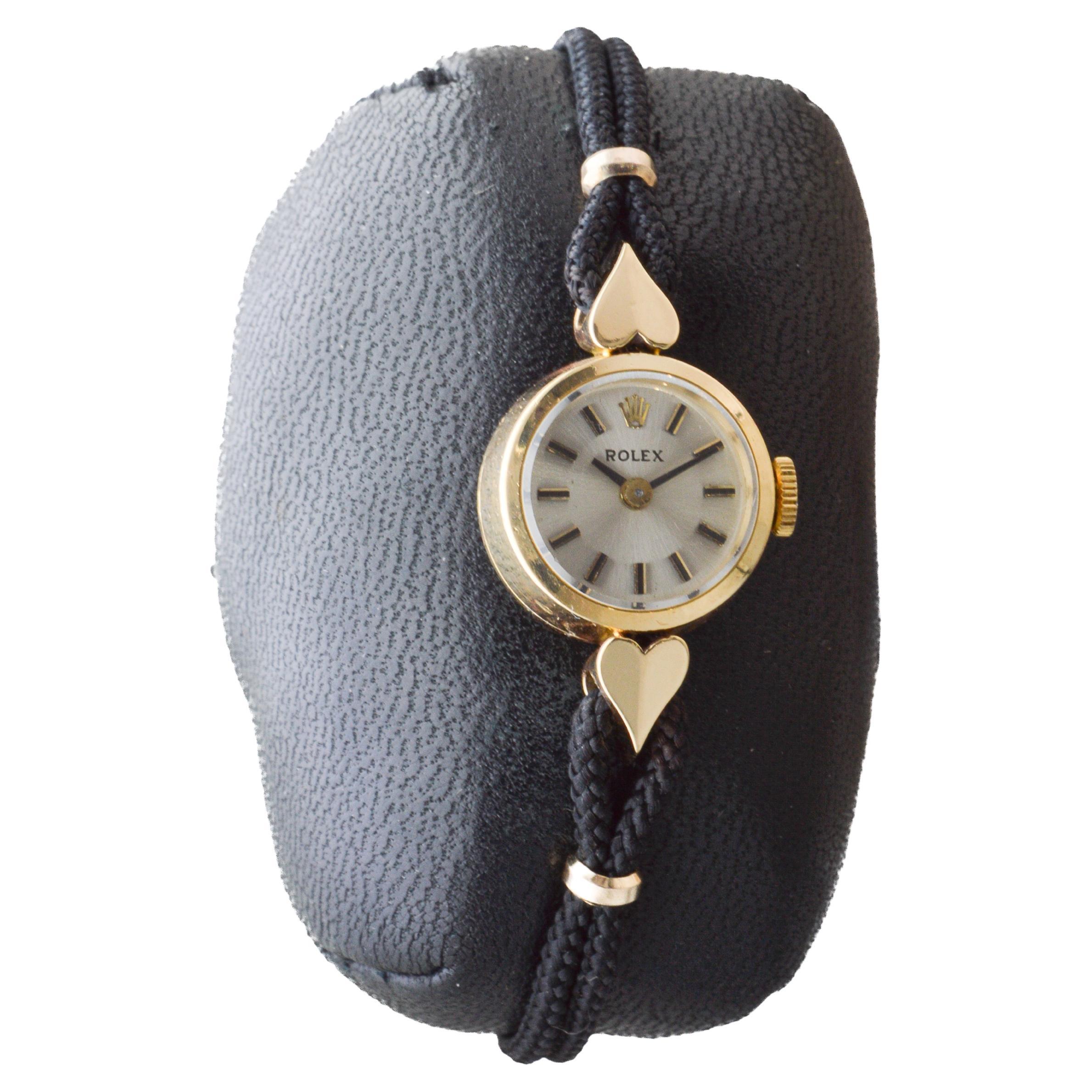 FACTORY / HOUSE: Rolex Watch Company
STYLE / REFERENCE: Orchid / Reference 9026A
METAL / MATERIAL: 18kt Solid Gold
CIRCA / YEAR: 1962
DIMENSIONS / SIZE: Length 28mm X Diameter 15mm
MOVEMENT / CALIBER: Manual Winding / 17 Jewels / Caliber 1400 
DIAL