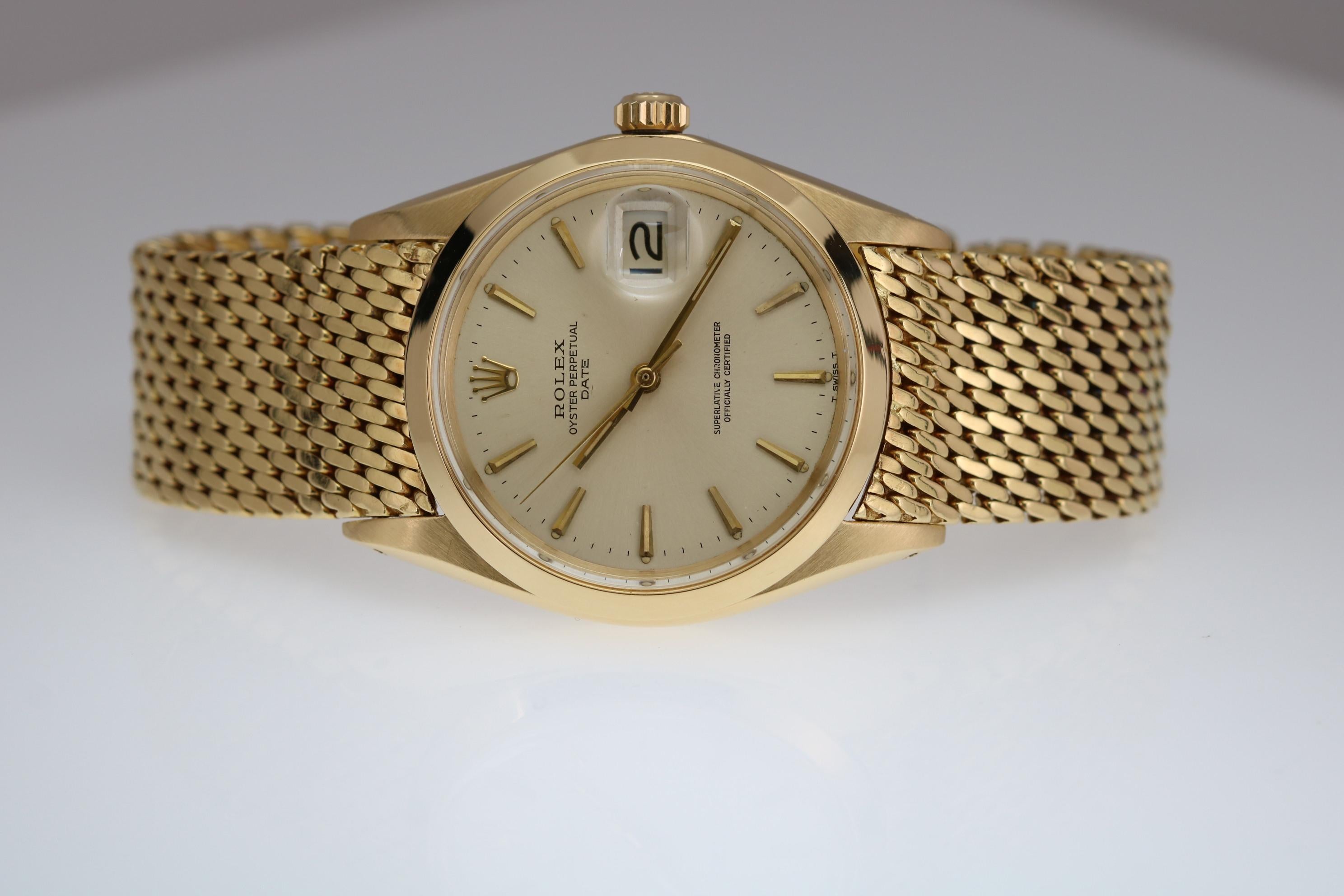 Rolex Date reference 1500 in 18k yellow gold on Rolex 18k yellow gold mesh bracelet.  34mm circa 1969