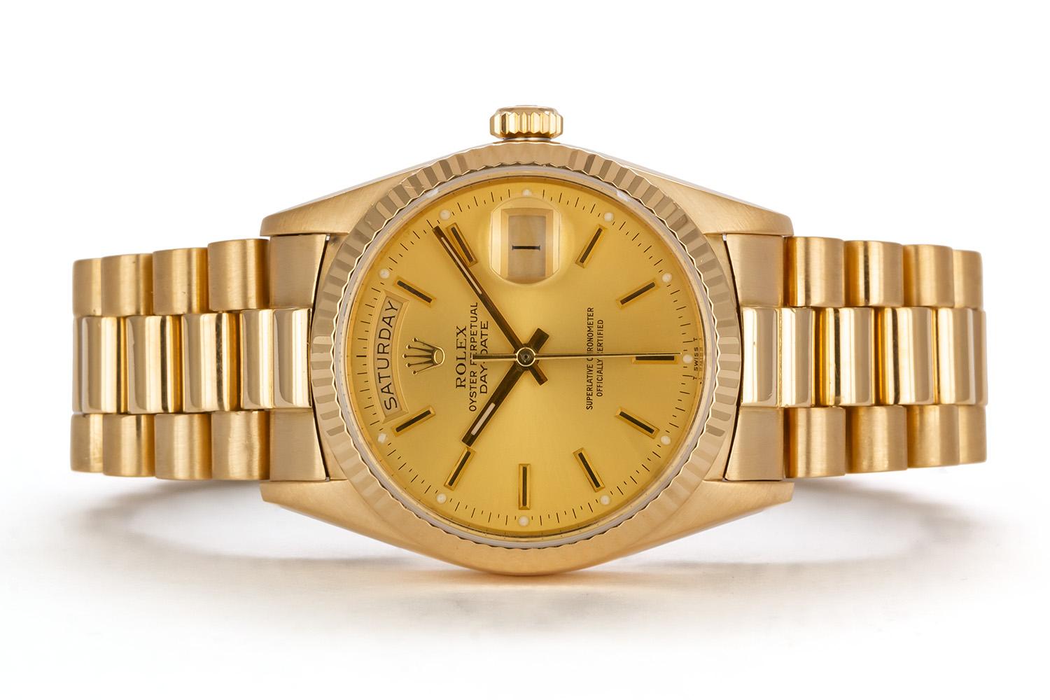 We are pleased to offer this 1984 Rolex 18k Yellow Gold Day-Date 36mm President 18048 Single-Quick with the original box and papers. This classic mens Rolex Day-Date dress watch features a 36mm solid 18k yellow gold case with a champagne stick dial