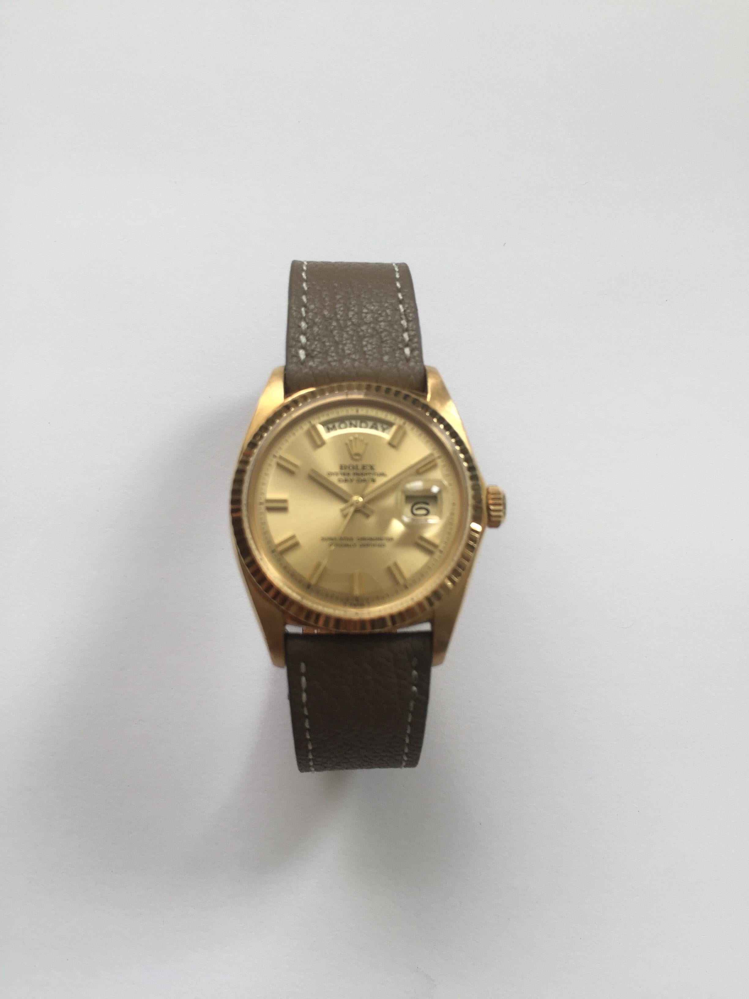 Rolex 18K Yellow Gold Oyster Perpetual Day-Date Automatic Watch
Rare Factory Champagne Non-Luminous 'Wide-Boy' Dial with Matching 'Wide-Boy' Hands.
Yellow Gold Gold Fluted Bezel
18K Yellow Gold Case
36mm in size 
Features Rolex Automatic Movement
