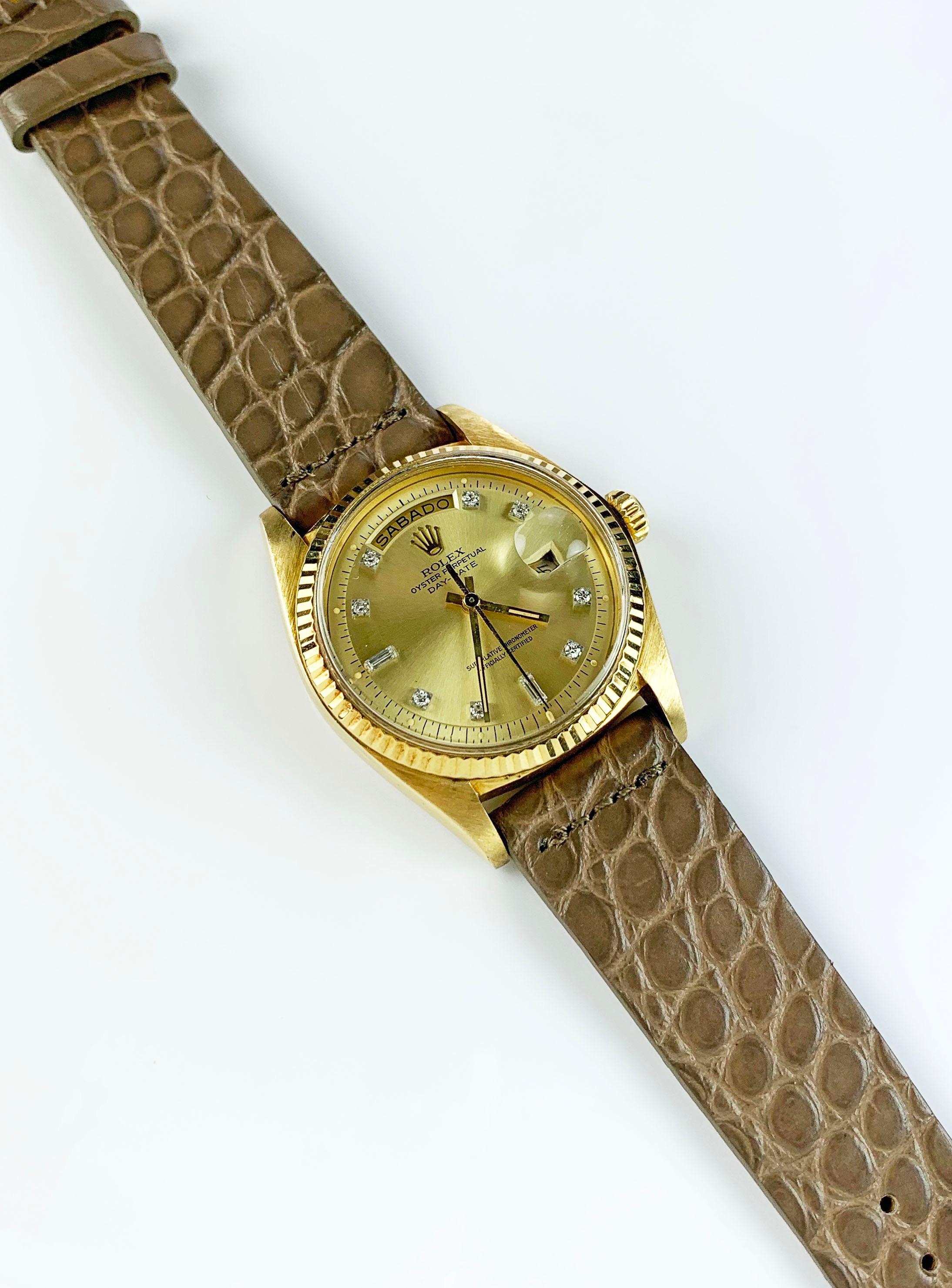 Rolex 18K Yellow Gold Day-Date Presidential Watch from the Early 1970's
Beautiful Factory Champagne Diamond Dial.
Yellow Gold Gold Fluted Bezel
18K Yellow Gold Case
36mm in size 
Features Rolex Automatic Movement with Calibre 1556 with Non-Quick Day
