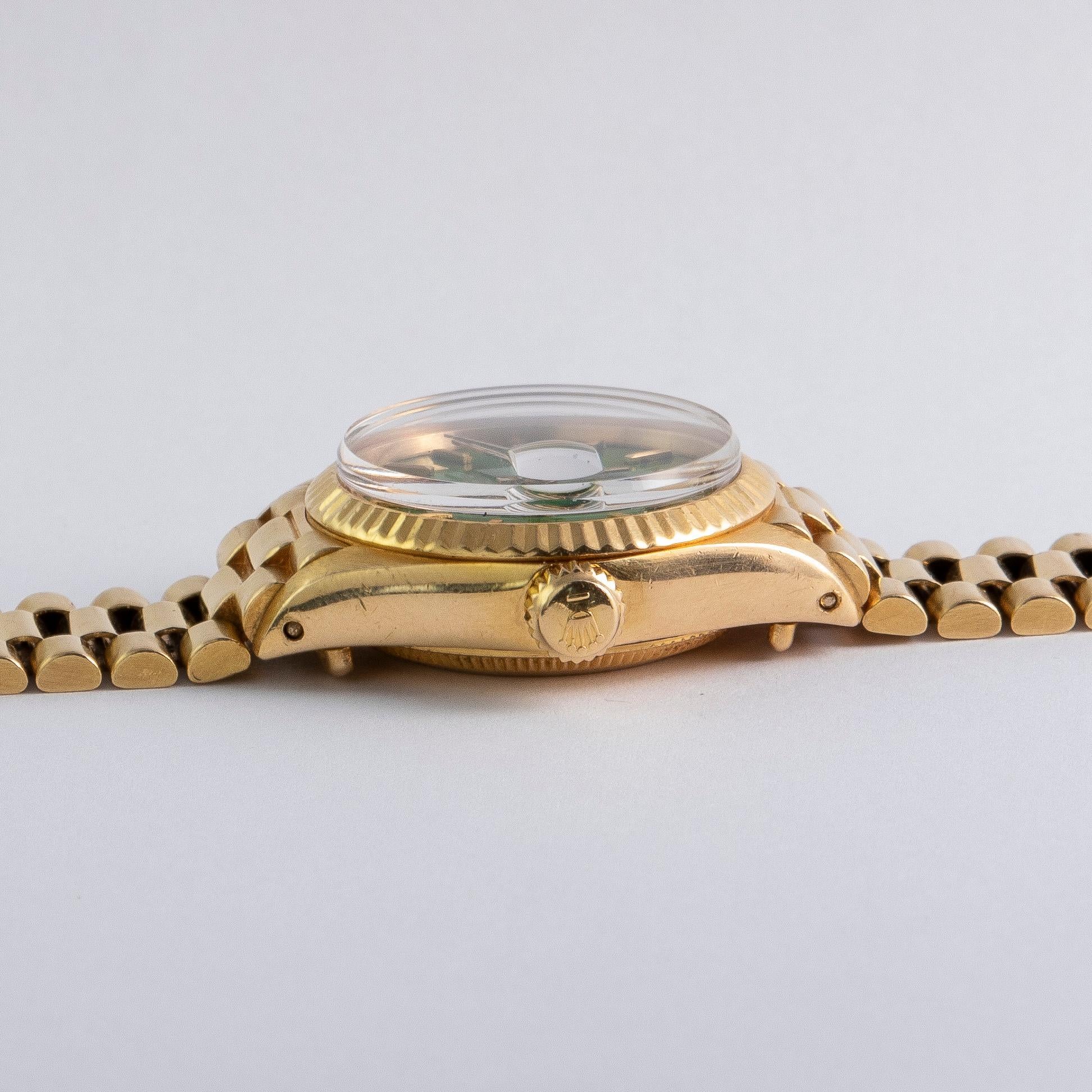 women's gold rolex with green face