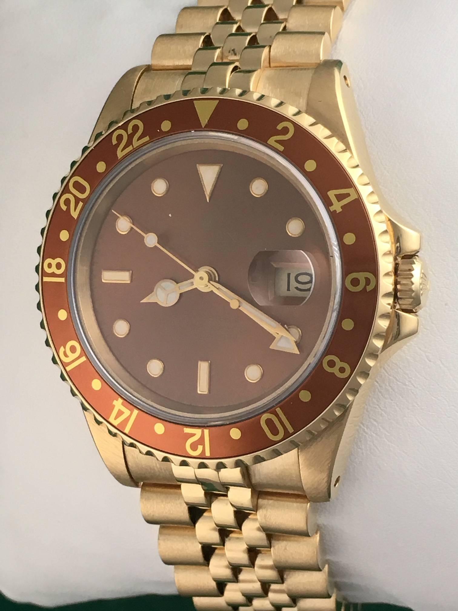 Rolex Men's GMT-Master II Model 16718 at a great price.  Automatic Winding Oyster Perpetual with Date Movement.  Featuring a stunning bronze dial with luminous markers,  18k yellow gold case with rotating bezel and bronze insert, and 18k Yellow Gold