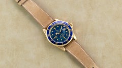 Rolex 18 Karat Gold Oyster Perpetual Submariner with Blue Gloss Earth Dial