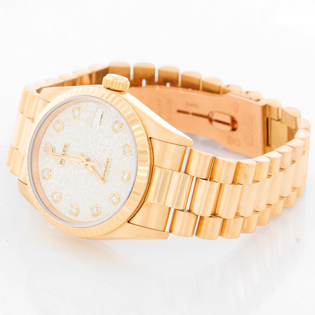 Rolex 18K Yellow Gold President Midsize Watch 68278 - Automatic. 18K yellow gold case with custom diamond bezel ( 31 mm ). Factory Silver Jubilee diamond dial. 18k yellow gold Rolex hidden-clasp President bracelet. Pre-owned with Rolex box and books.