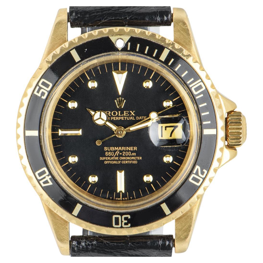 A Rare 18k Yellow Gold Omani Crest Submariner Date Vintage Men's Wristwatch, original matte black nipple dial, date at 3 0'clock, an 18k yellow gold bi-directional rotating bezel with a black bezel insert, an original black leather strap with an