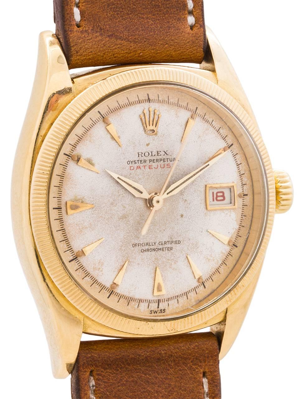 
An early, rare, and fine condition Rolex “Ovetone” Datejust model ref 6305 serial # 971,xxx circa 1954 with original  dial with red printed “Datejust” and red print date wheel. Featuring 36mm diameter 18K yellow gold case with finely milled bezel,
