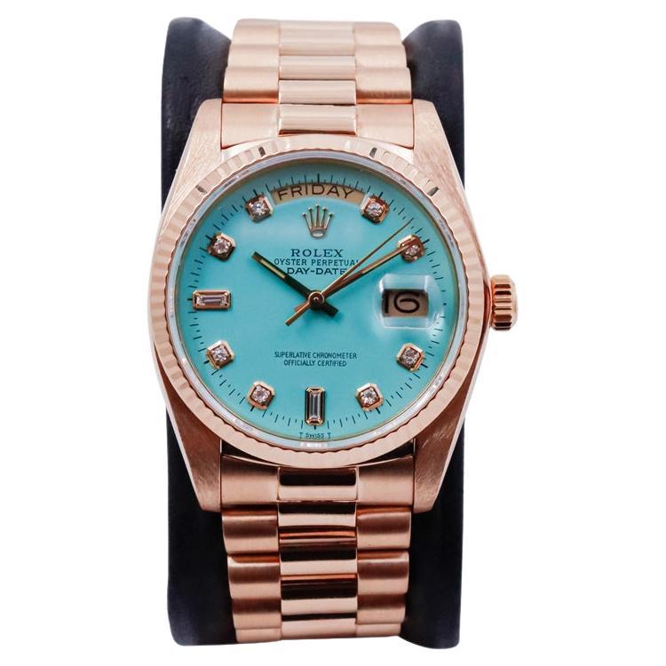 FACTORY / HOUSE: Rolex Watch Company
STYLE / REFERENCE: Day Date / President / Reference 18038
METAL / MATERIAL: 18Kt. Solid Yellow Gold
CIRCA / YEAR: 1984 / 85
DIMENSIONS / SIZE: Length 43mm X Diameter 35mm
MOVEMENT / CALIBER:  Winding / 27 Jewels