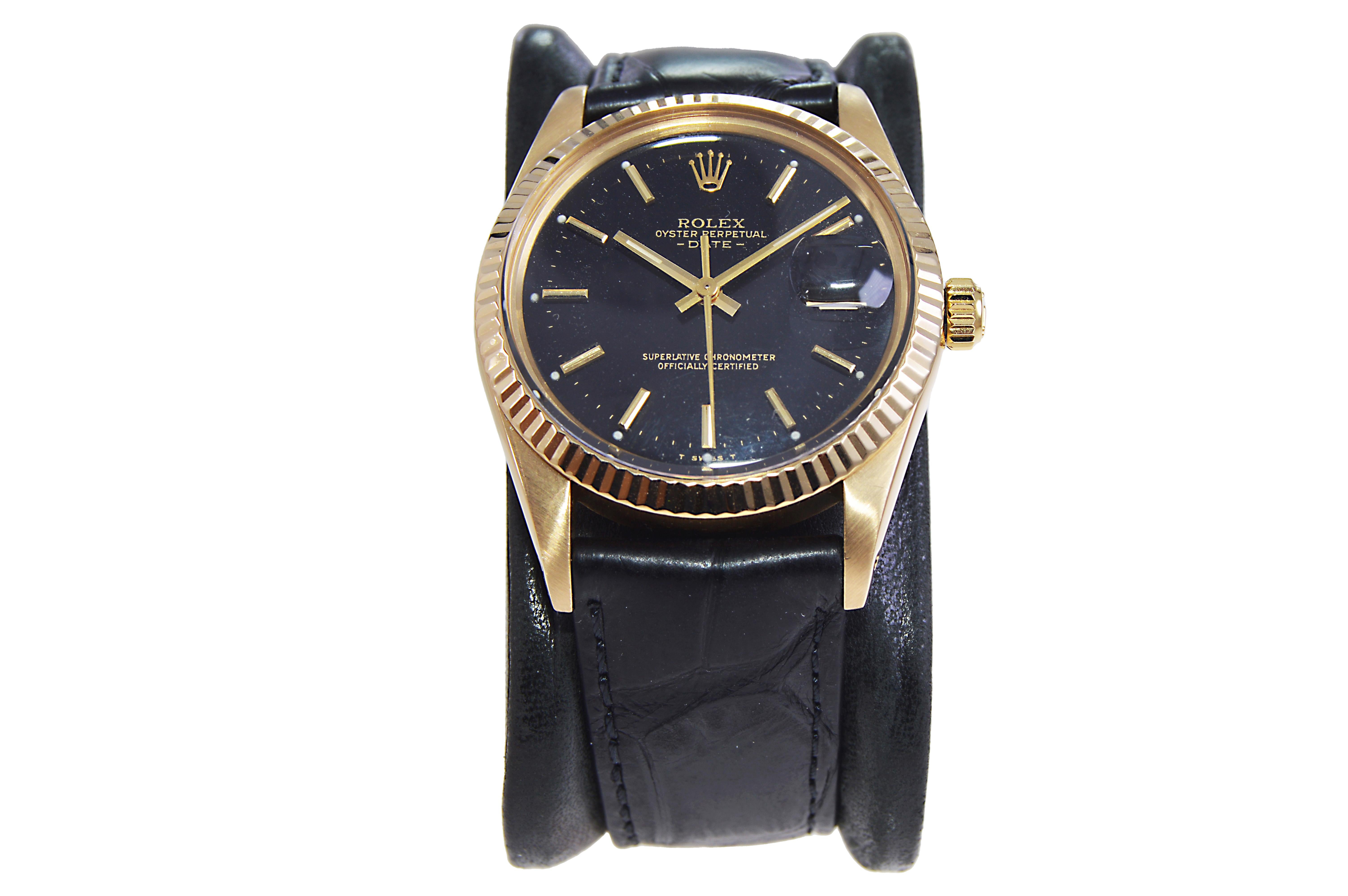 rolex oyster perpetual black and gold