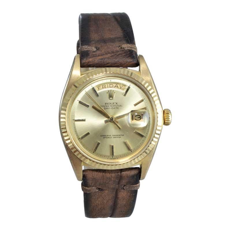 FACTORY / HOUSE: Rolex Watch Co.
STYLE / REFERENCE: Day Date / Ref 1803
METAL / MATERIAL: 18Kt
CIRCA / YEAR: 1969
DIMENSIONS / SIZE: 44mm x 36mm 
MOVEMENT / CALIBER: Oyster Perpetual Winding / 26 Jewels 
DIAL / HANDS: Original Brushed Gold / Gold