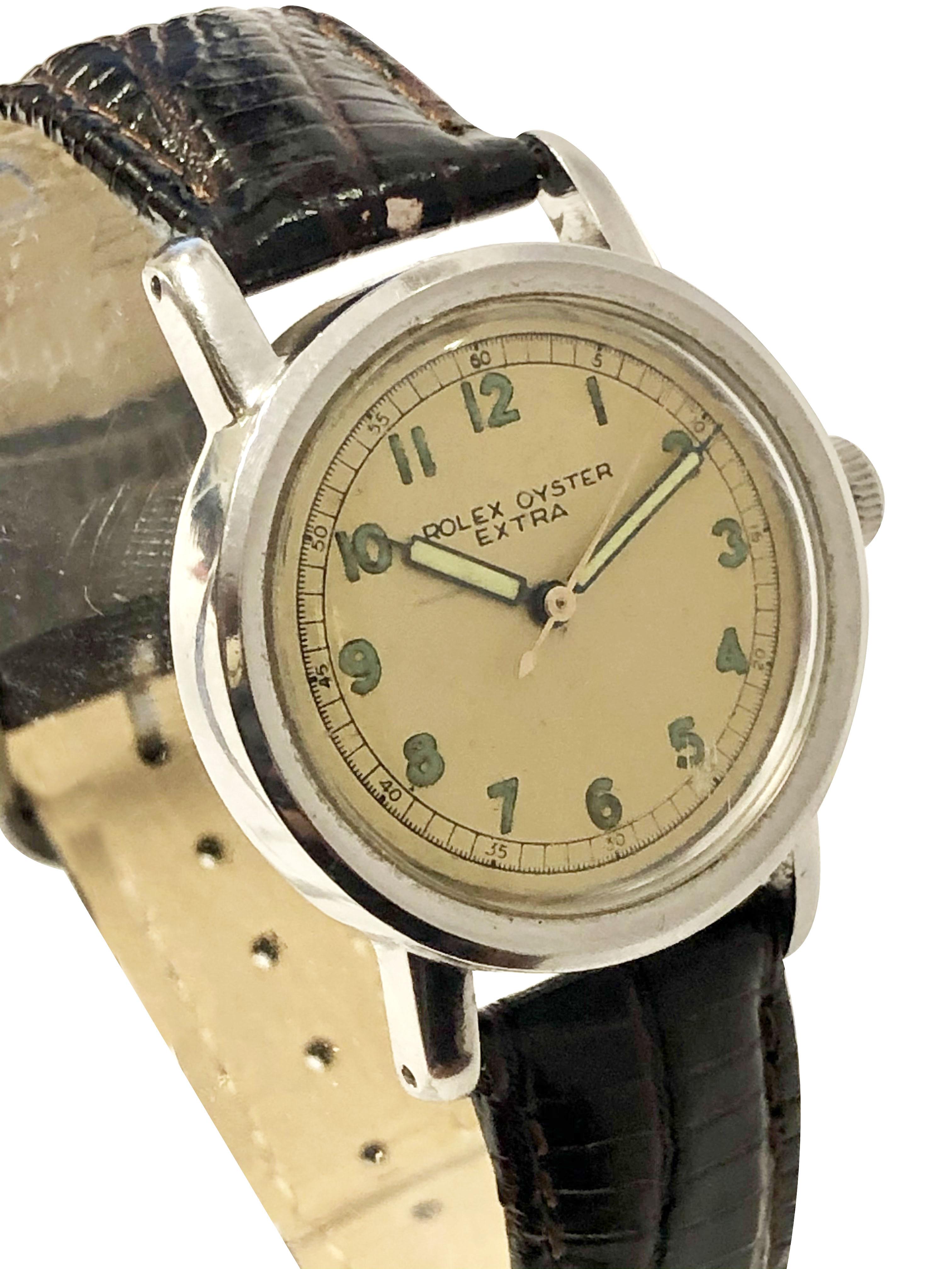 Circa late 1930s Rolex Extra, also known as the Athlete model Wrist Watch, 32 M.M. Stainless Steel 2 piece Water Resistant Oyster Case. 17 Jewel Mechanical, Manual wind movement. we do believe that this dial is original, slight yellowed, off white