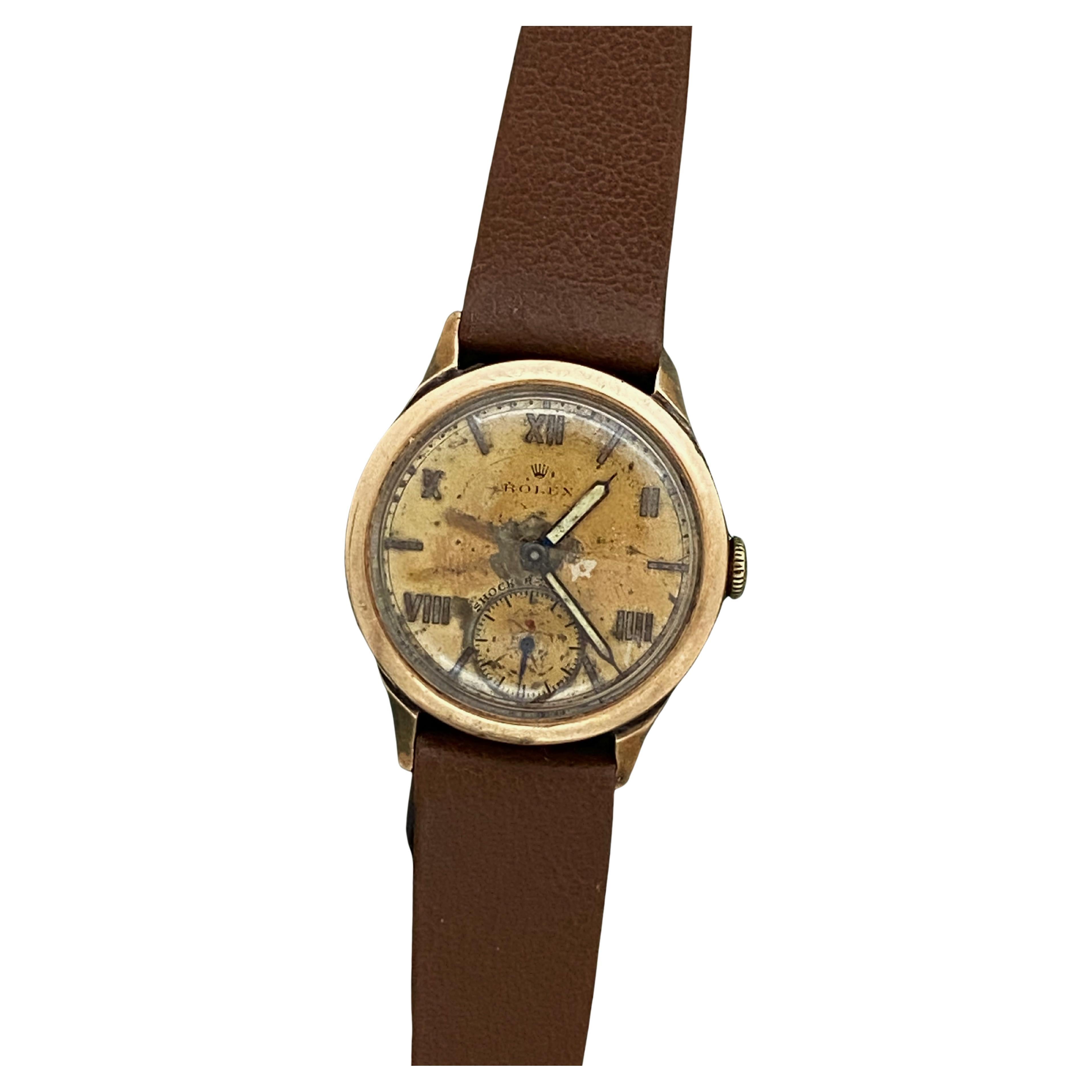 This Rare Art-Deco c1940’s Unisex Rolex wristwatch features: 

9K Rose Gold 29mm Case, 
well-proportioned, signed & stamped to the back 

Rare Dial that aged beautifully with charming patina,
featuring mix of Roman numerals (every 10 minutes),