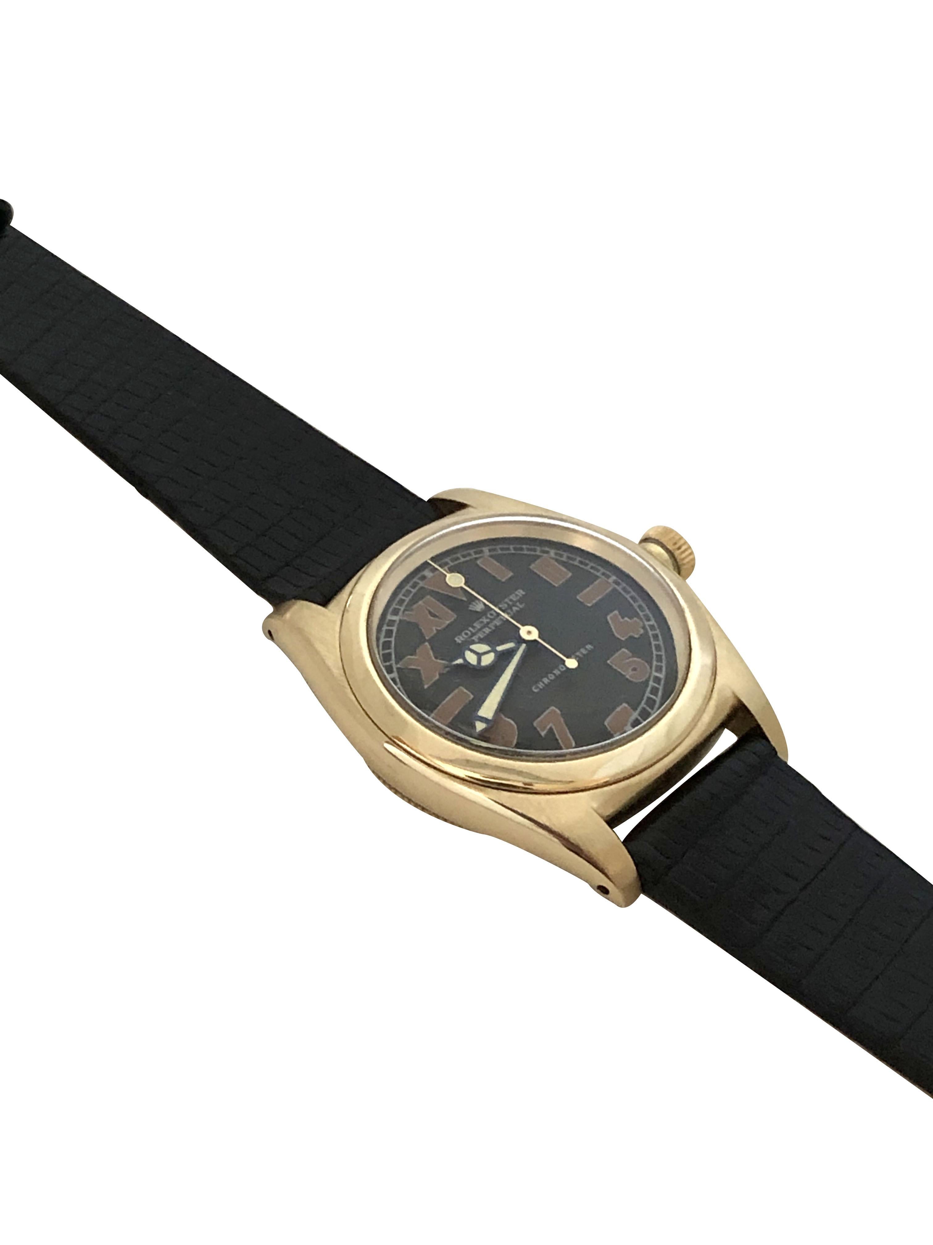 Circa 1948 Rolex Bubble Back Wrist Watch, 32 M.M. 3 Piece 14K Yellow Gold case with smooth Bezel, Automatic, Self Winding movement. Restored  Black Dial with Radium style filled Half Roman and Half Arabic numerals, restored Mercedes Hands with sweep