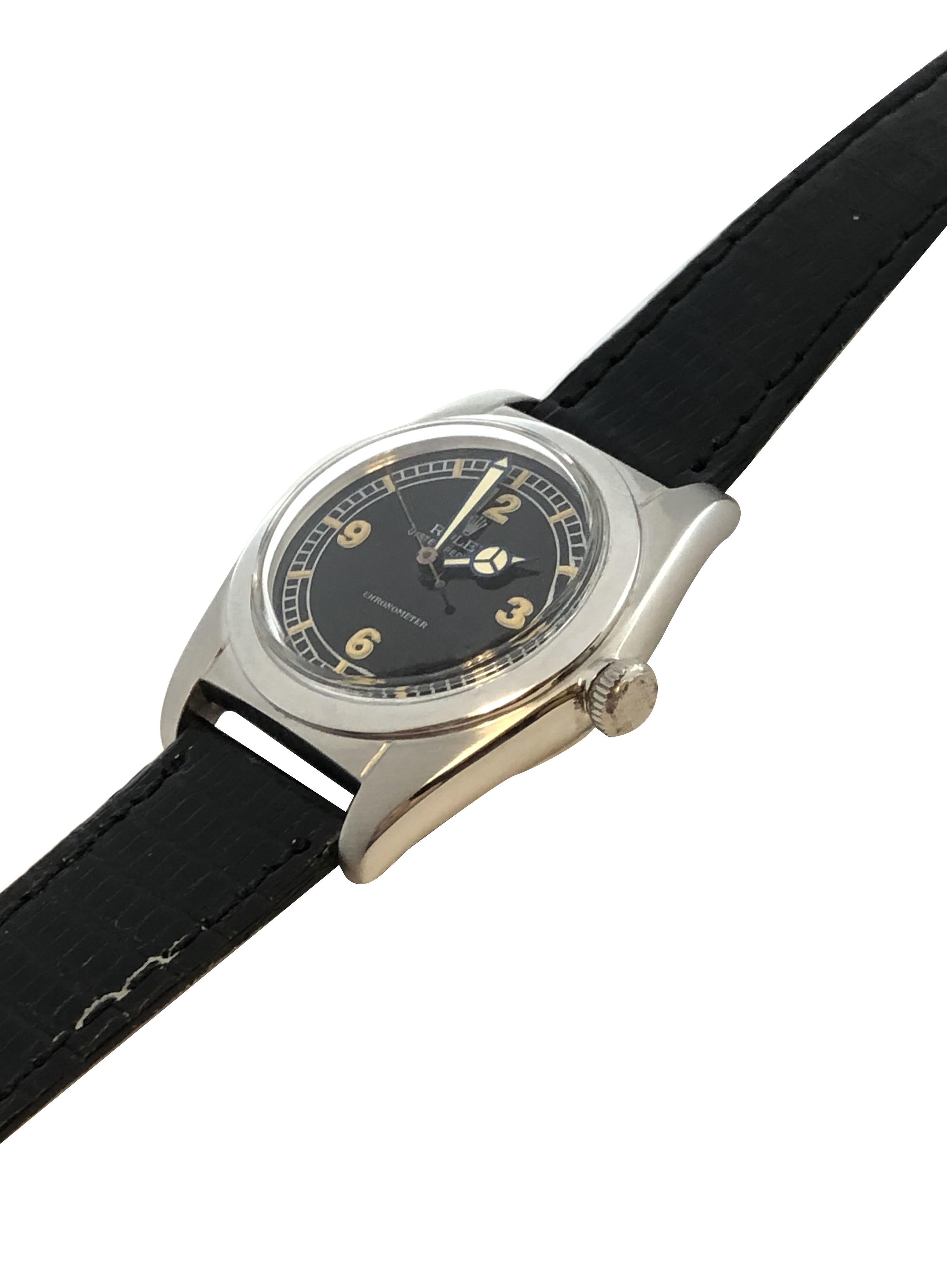 Circa 1946 Rolex Reference 2940  Bubbleback model Wrist Watch, 39 M.M. ( lug end to end ) X 32 M.M. Stainless Steel 2 piece case. 17 Jewel Automatic, self winding movement. Newly restored as original Black Matt Dial with raised white painted