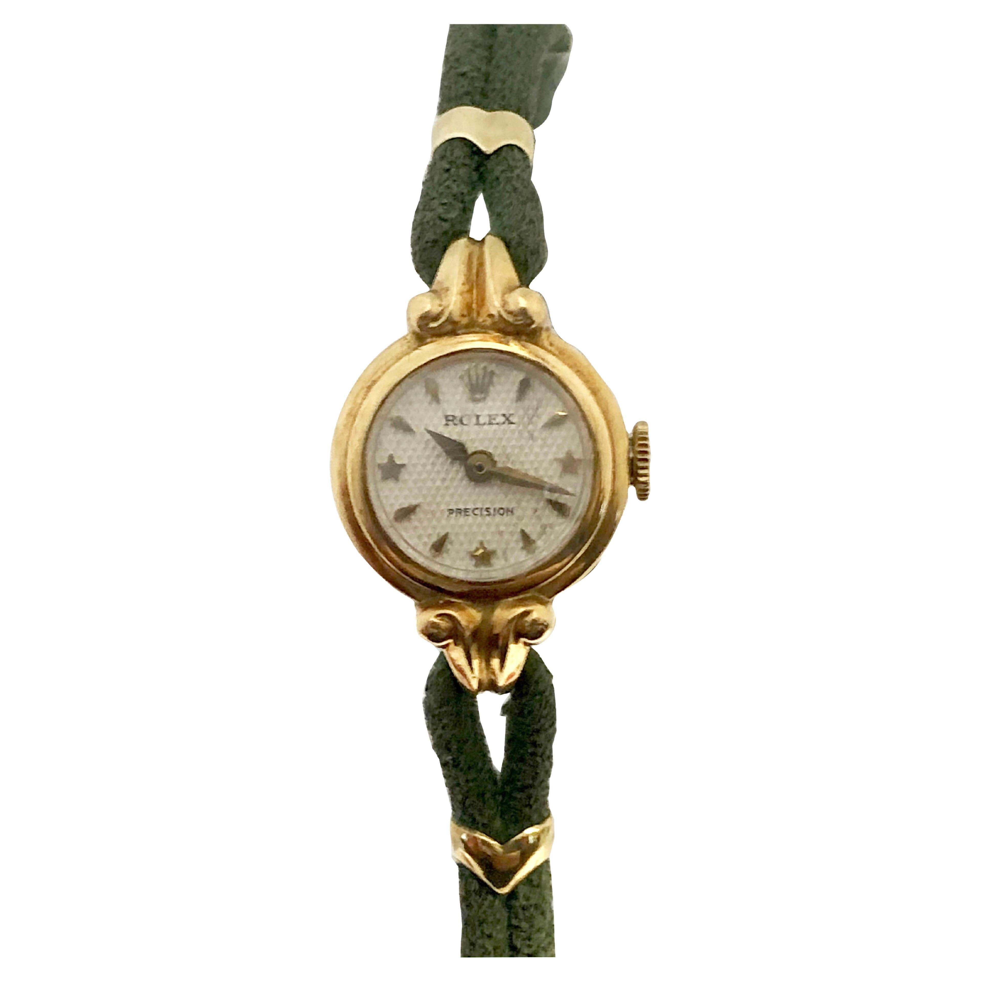 Circa early 1950s Rolex Reference 4810 Ladies Wrist Watch, 15 M.M. 18K Yellow Gold 2 piece case, 17 Jewel mechanical, manual wind movement, Original mint condition White Honeycomb Dial with Raised Gold Star and Arrowhead markers, original Domed