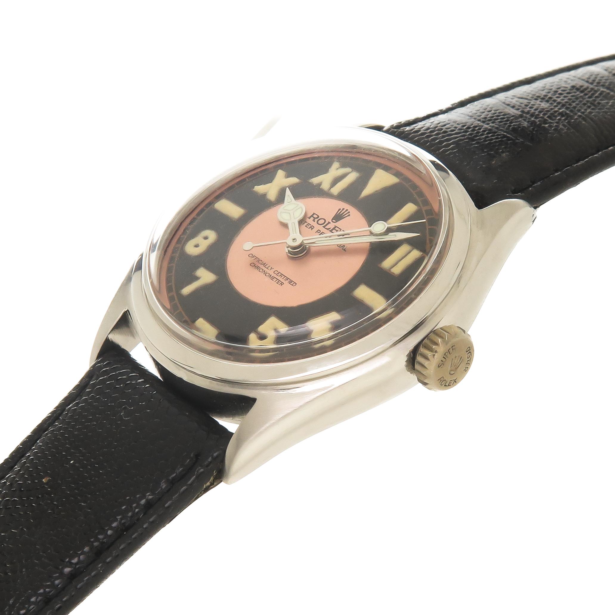 Circa 1952 Rolex Reference 6106, 34 MM & Steel 2 piece case. Caliber 1300 Automatic, self winding movement. Custom Black and Rose California style dial with half Roman and half Arabic numerals with Luminous, Mercedes Hands and a center sweep hand.