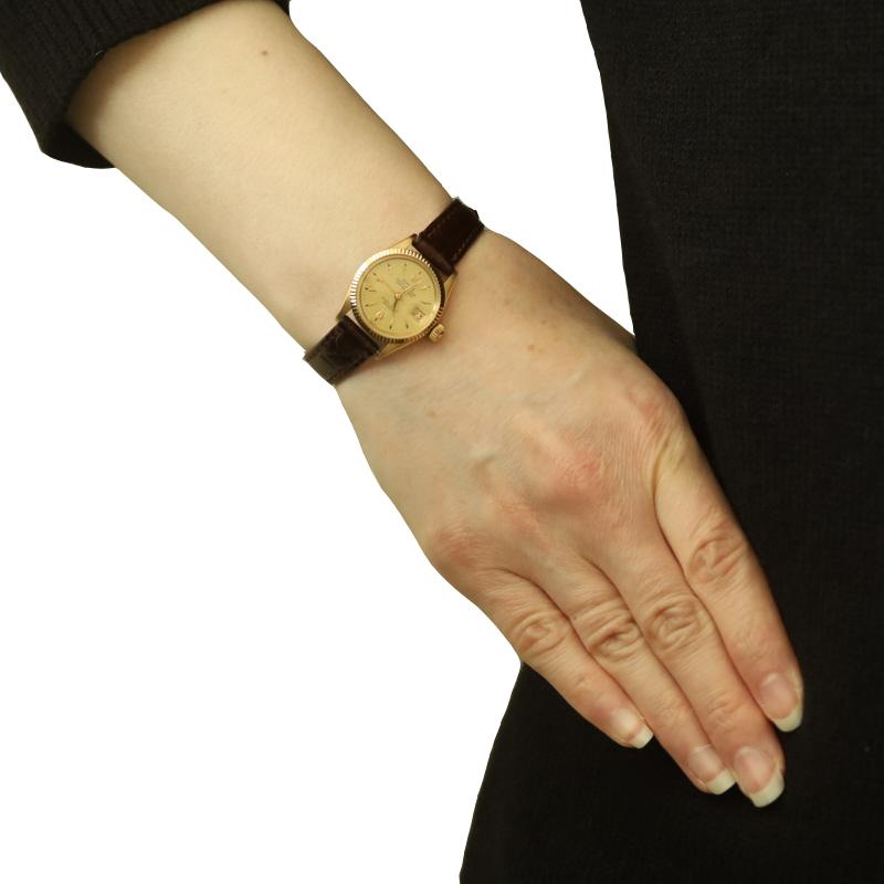 Brand: Rolex
Model: Lady-Datejust
Model Number: 6517
Movement: Automatic
Warranty: One Year
Year: 1958
Movement Maker: Swiss
Dial Color: Champagne

Metal Content: 18k Yellow Gold

Material Information
Genuine Leather
Color: Brown

Fastening Type: