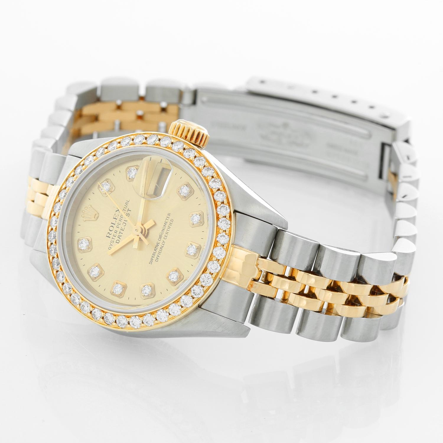 Rolex  2-Tone Datejust Steel & Gold Ladies Watch 69173 - Automatic winding, 29 jewels, Quickset date, sapphire crystal. Stainless steel case with custom diamond bezel. Factory Champagne diamond dial. Stainless steel and 18k yellow gold Jubilee