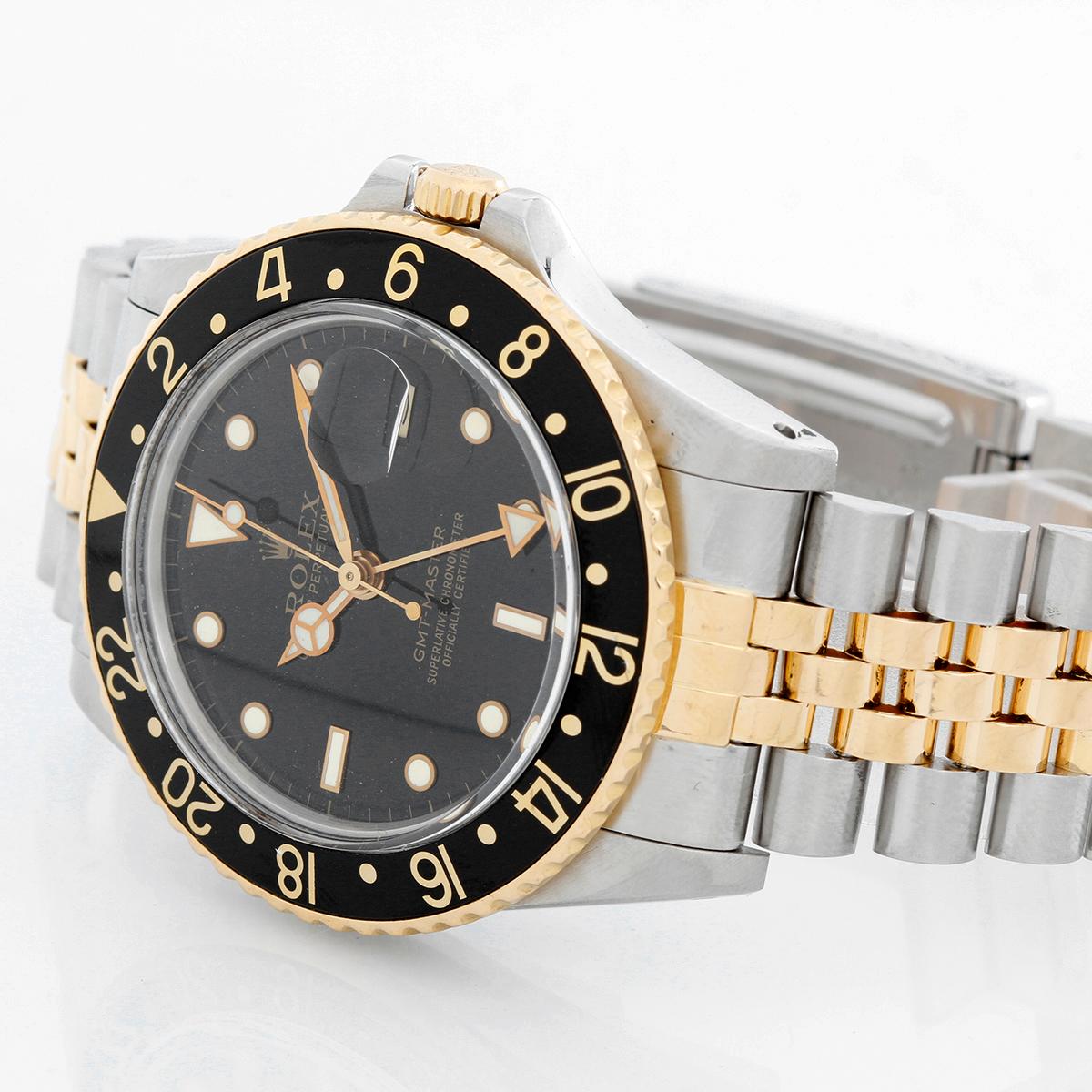 Rolex 2-Tone GMT-Master 16753 -  Automatic winding. Stainless steel with gold bezel ( 40 mm ). black dial with gold framed hour markers with date. 18K gold and steel 2-tone Rolex Jubilee bracelet with deployant clasp. Pre-owned with Rolex box.