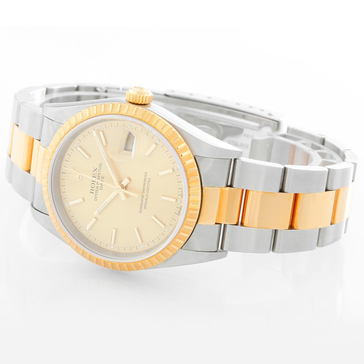 Rolex 2-Tone Steel Gold 34mm Date Men's/Ladies Watch 15223- Automatic winding, Quickset, sapphire crystal. Stainless steel case with yellow gold fluted bezel (34mm diameter). Champagne dial with stick markers. Stainless steel and 18k yellow gold