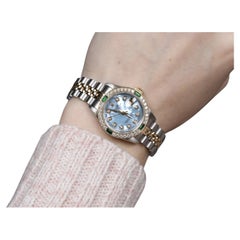 Rolex Montre Datejust en nacre bleue avec cadran en diamants et émeraudes 69173