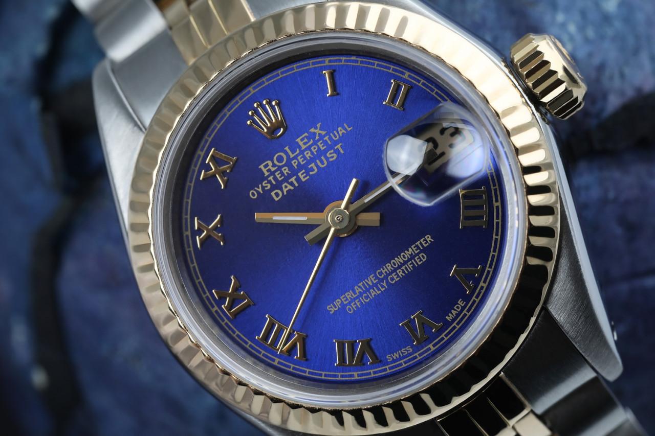 Ladies Vintage Rolex 26mm Datejust Two Tone Blue Color Custom Roman Numeral Dial 69173

This watch is in like new condition. It has been polished, serviced and has no visible scratches or blemishes. All our watches come with a standard 1 year