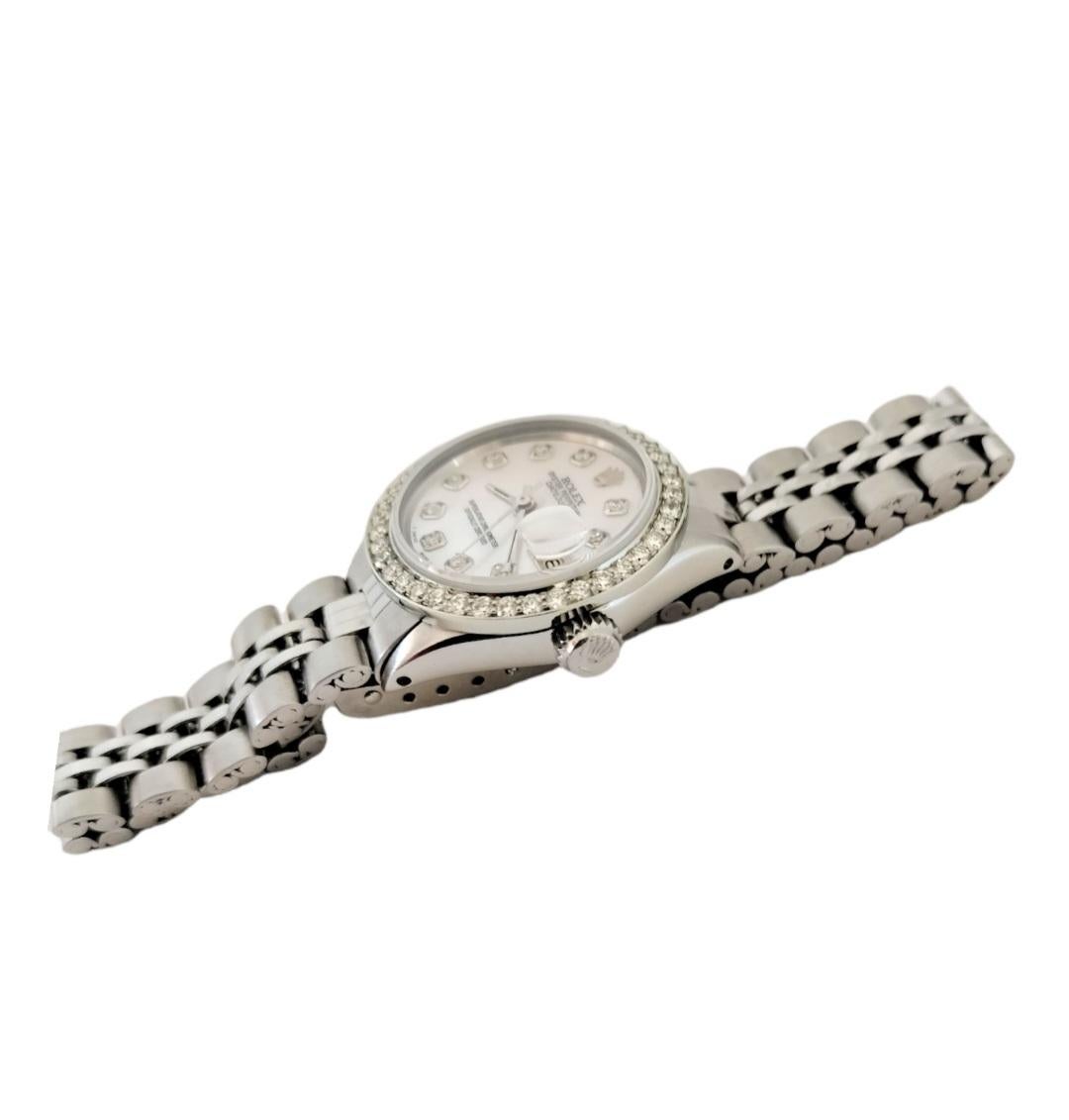 Brand - Rolex
Gender - Ladies
Model - 6517 Datejust 
Metals - Stainless steel 
Case size - 26mm
Bezel - Steel Diamond
Crystal - Sapphire
Movement - Automatic Rolex Cal.1161
Dial - Refinished White Mother of Pearl 
Wrist band - Steel Folded
