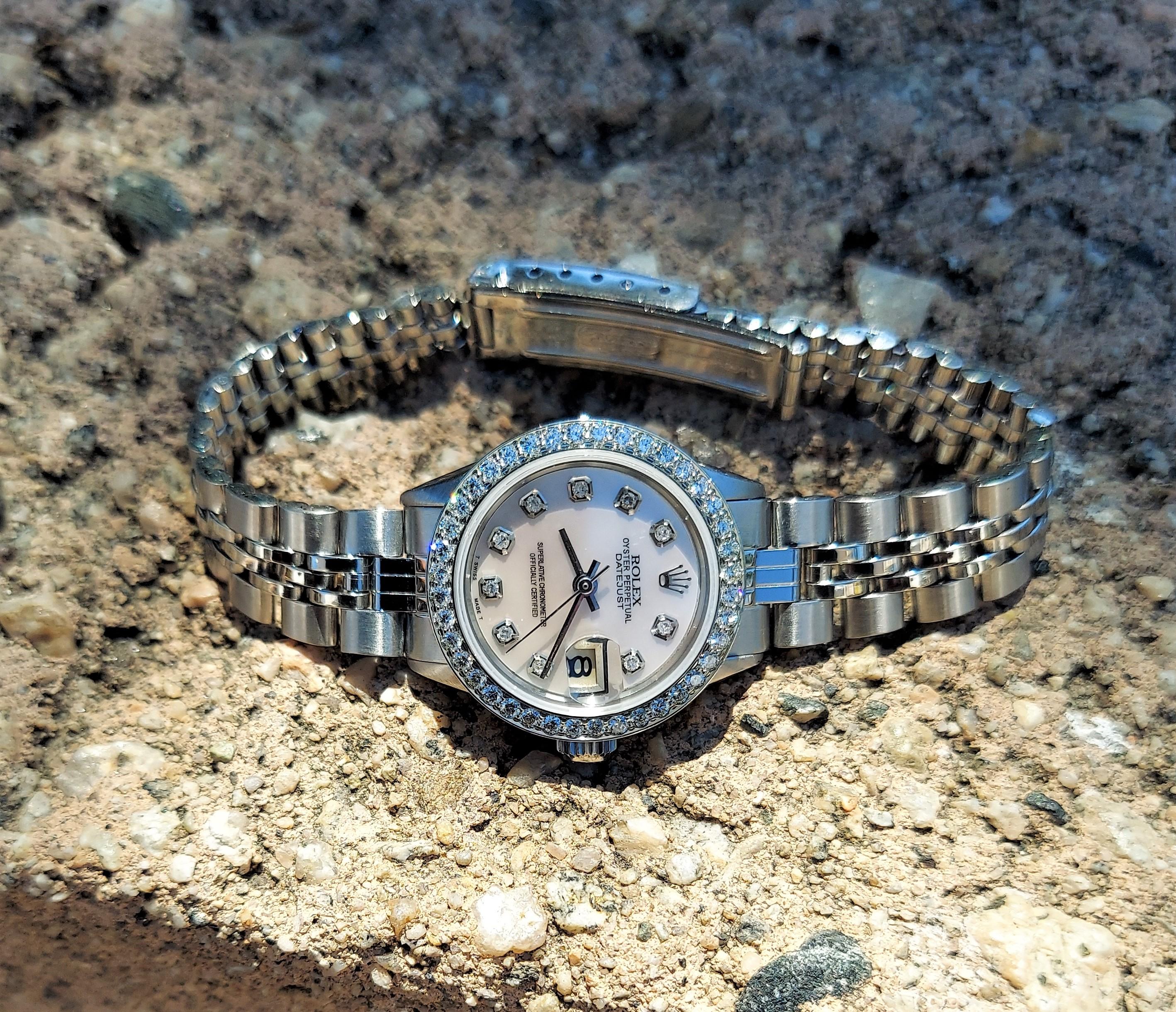 Brand - Rolex
Gender - Ladies
Model - 6517 Datejust 
Metals - Stainless steel 
Case size - 26mm
Bezel - Steel Diamond
Crystal - Sapphire
Movement - Automatic Rolex Cal.1161
Dial - Refinished White Mother of Pearl 
Wrist band - Steel Folded