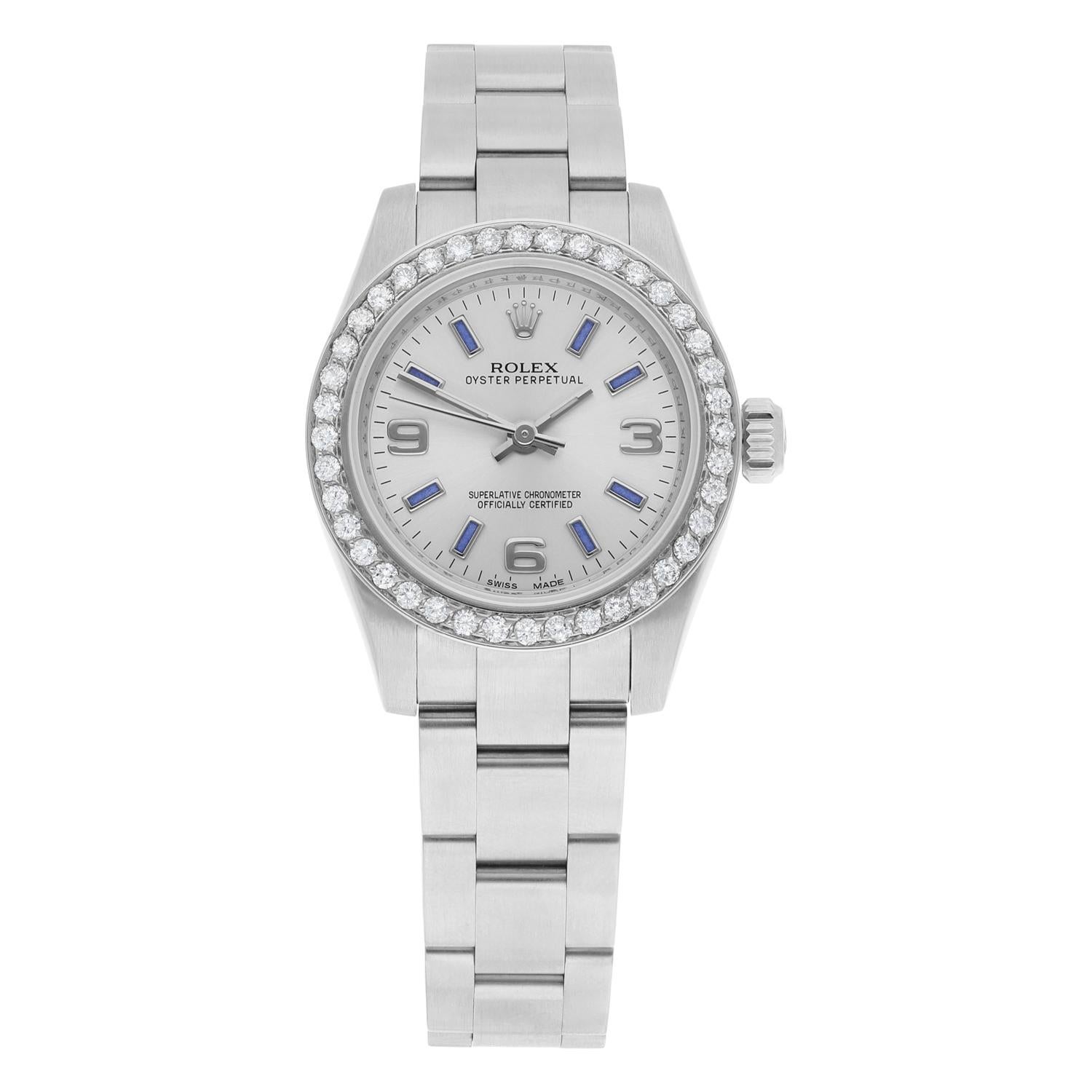 This elegant Rolex Lady-Datejust wristwatch is a timeless piece of luxury that will be cherished for years to come. The bezel is set with diamonds aftermarket, diamonds are 100% natural. The dial features square blue indexes and Arabic numerals.