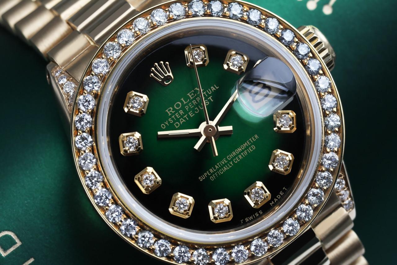 Rolex 26mm Presidential 18kt Gold Green Diamond Dial Bezel and Lugs 6917

This watch is in like new condition. It has been polished, serviced and has no visible scratches or blemishes. All our watches come with a standard 1 year mechanical warranty