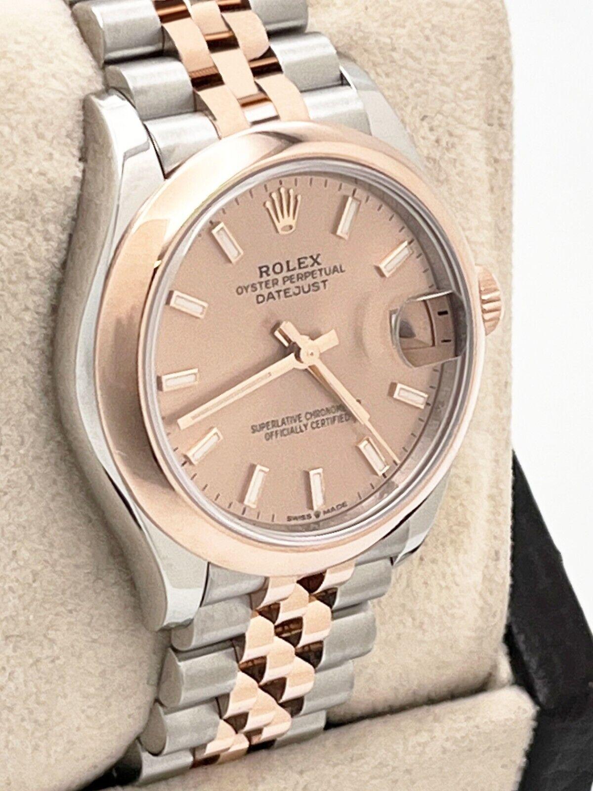Style Number:  278241
Serial: 814YZ231
Model: Midsize Datejust 
Case Material: Stainless Steel 
Band: 18K Rose Gold & Stainless Steel 
Bezel: 18K Rose Gold 
Dial: Rose Color Dial 
Face: Sapphire Crystal 
Case Size: 31mm 
Includes: 
-Rolex