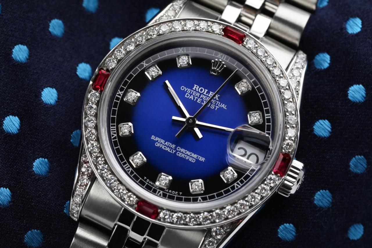 Rolex 31mm Datejust with custom Blue Vignette Diamond Dial+ Rubies on a Bezel+Diamond Lugs 68274

This watch is in like new condition. It has been polished, serviced and has no visible scratches or blemishes. All our watches come with a standard 1