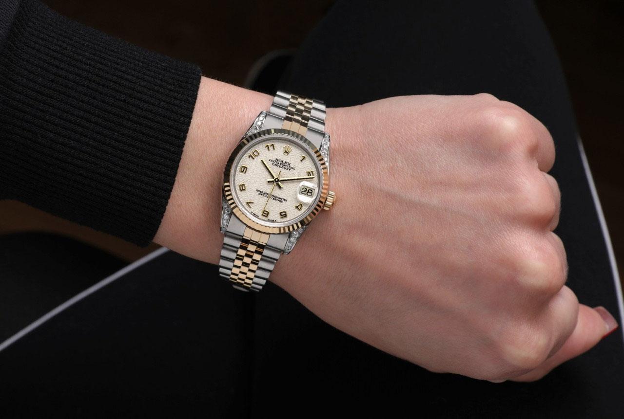 Rolex 31mm Datejust Champagne Dial Diamond Lugs Ruby and Diamond Bezel Watch
 We take great pride in presenting this timepiece, which is in impeccable condition, having undergone professional polishing and servicing to maintain its pristine