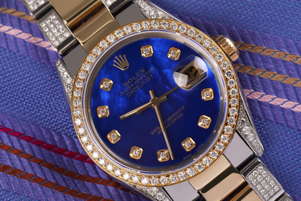 Rolex 31mm Datejust 2Tone 18K Gold + SS Blue Pearl Diamond Dial Diamonds on a Side Band + Bezel+Lugs 68273

This watch is in like new condition. It has been polished, serviced and has no visible scratches or blemishes. All our watches come with a