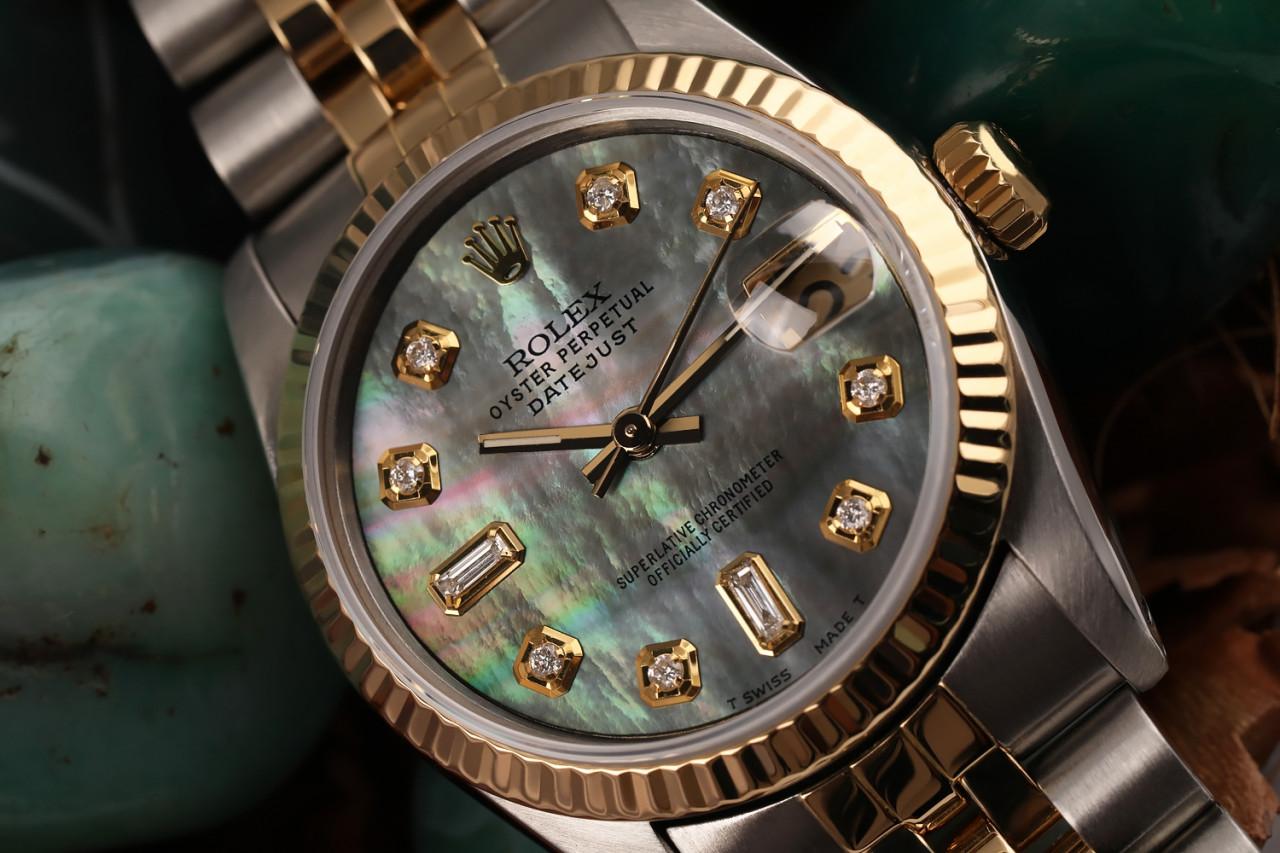 Women's Vintage Rolex 31mm Datejust Two Tone Black MOP Mother Of Pearl with 8 + 2 Diamond Accent 68273 

This watch is in like new condition. It has been polished, serviced and has no visible scratches or blemishes. All our watches come with a