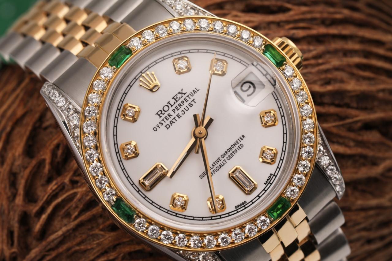 Women's Rolex 31mm Datejust Two Tone Jubilee White Color Dial 8+2 Diamond Accent RRT Bezel + Lugs + Emerald 68273

This watch is in like new condition. It has been polished, serviced and has no visible scratches or blemishes. All our watches come