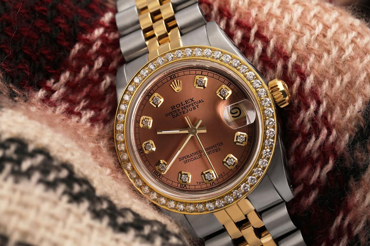 Women's Rolex 31mm Datejust Vintage Diamond Bezel Two Tone Salmon Color Dial with Diamond Accent RT 68273

This watch is in like new condition. It has been polished, serviced and has no visible scratches or blemishes. All our watches come with a