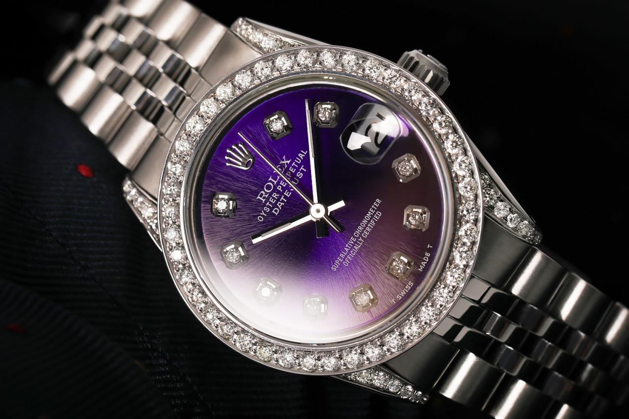Rolex 31mm Datejust With custom Diamond bezel SS Purple Color Dial Bezel and Lugs with Diamond Accent Deployment buckle 68274

This watch is in like new condition. It has been polished, serviced and has no visible scratches or blemishes. All our