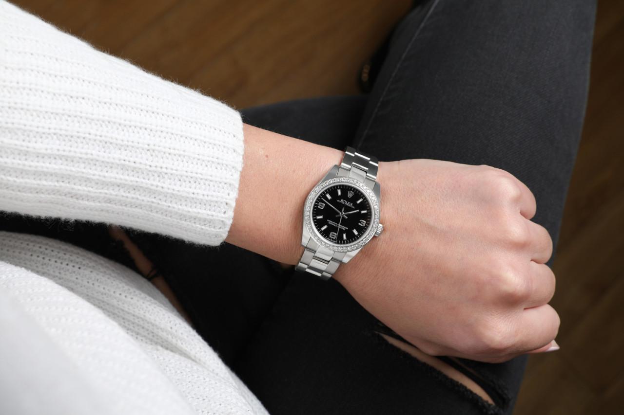 Rolex Oyster Perpetual Black Dial Custom Diamond Bezel Ladies SS Watch In Excellent Condition For Sale In New York, NY