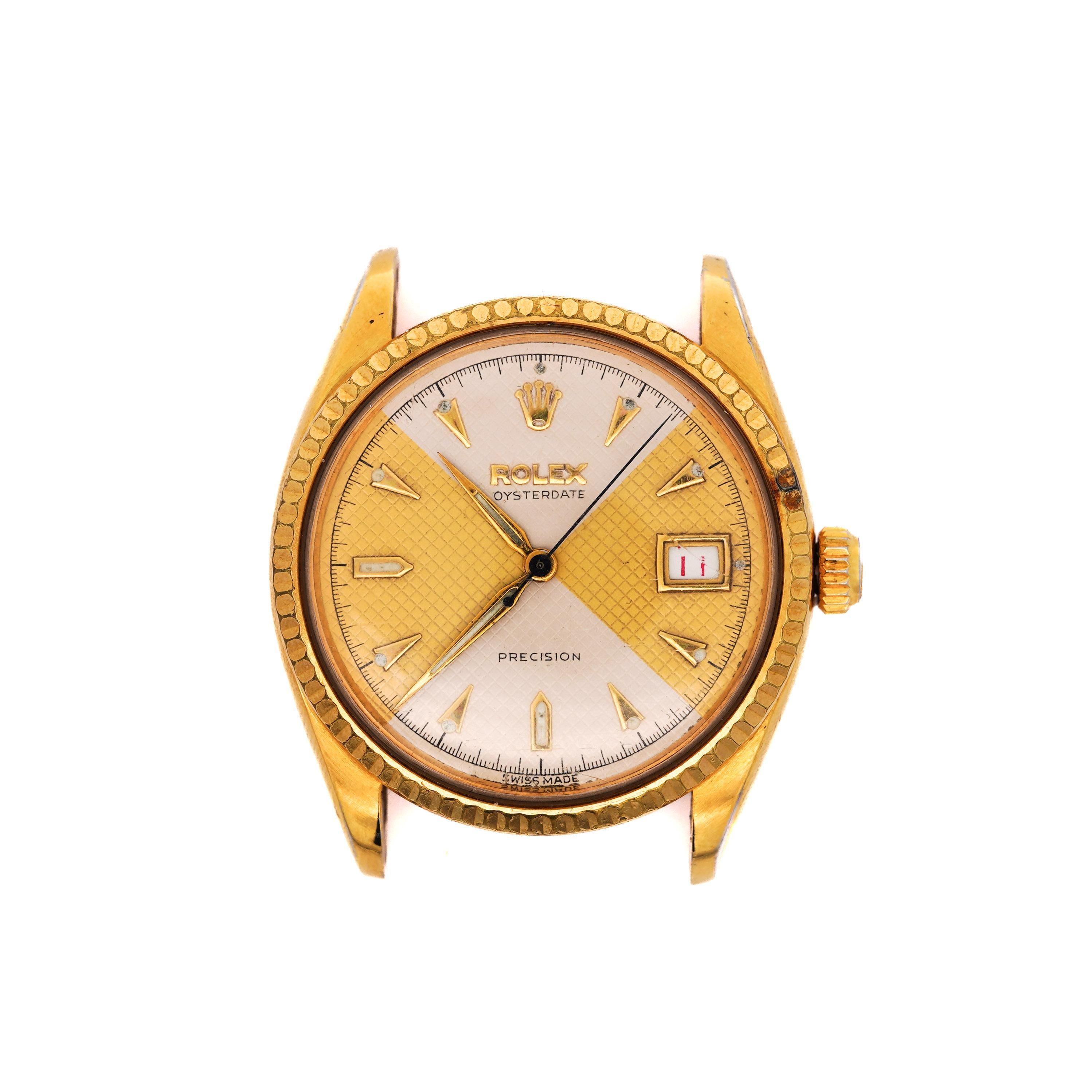 This Rolex Oysterdate Precision 6294 features a striking Honeycomb Bowtie two-tone dial, paired with a classic gold-tone case. The watch, with Serial #992492, was produced in the 1950's, specifically between 1953-1963. This vintage timepiece exudes