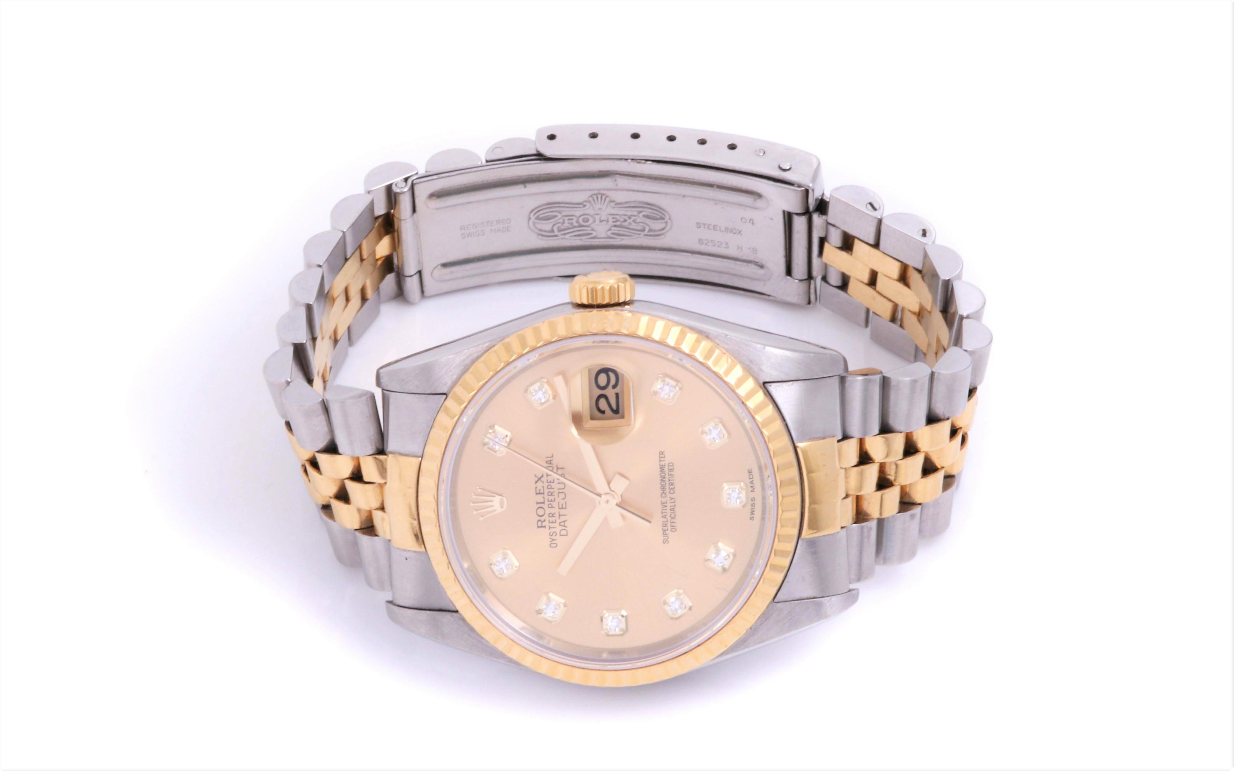 (Watch Description)
Brand - Rolex
Gender - Unisex
Model - 16013 Datejust
Metals - Yellow Gold / Steel 
Case size - 36mm
Bezel -Yellow Gold Fluted
Crystal - Acrylic
Movement - Automatic caliber 3035
Dial - Refinished Champagne Diamond
Wrist band -