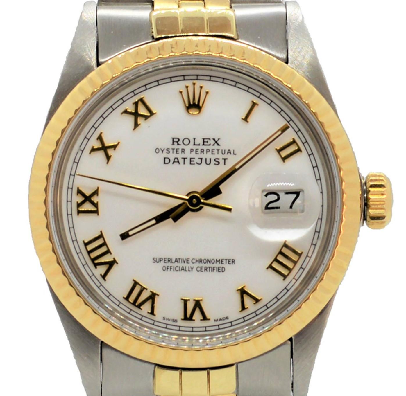 Brand - Rolex 
Model - 16013 Datejust
Case Size - 36mm
Crystal - Acrylic 
Dial - Roman Numeral 
Bezel - Yellow Gold Fluted 
Movement - Rolex Caliber 3035
Wrist Band - Rolex two tone Jubilee
