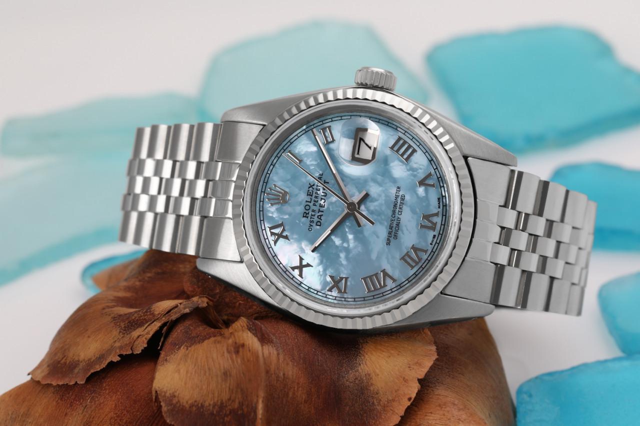 Rolex 36mm Datejust Baby Blue Mother Of Pearl Roman Numeral Dial with 18k Fluted Bezel 16030

This watch is in like new condition. It has been polished, serviced and has no visible scratches or blemishes. All our watches come with a standard 1 year