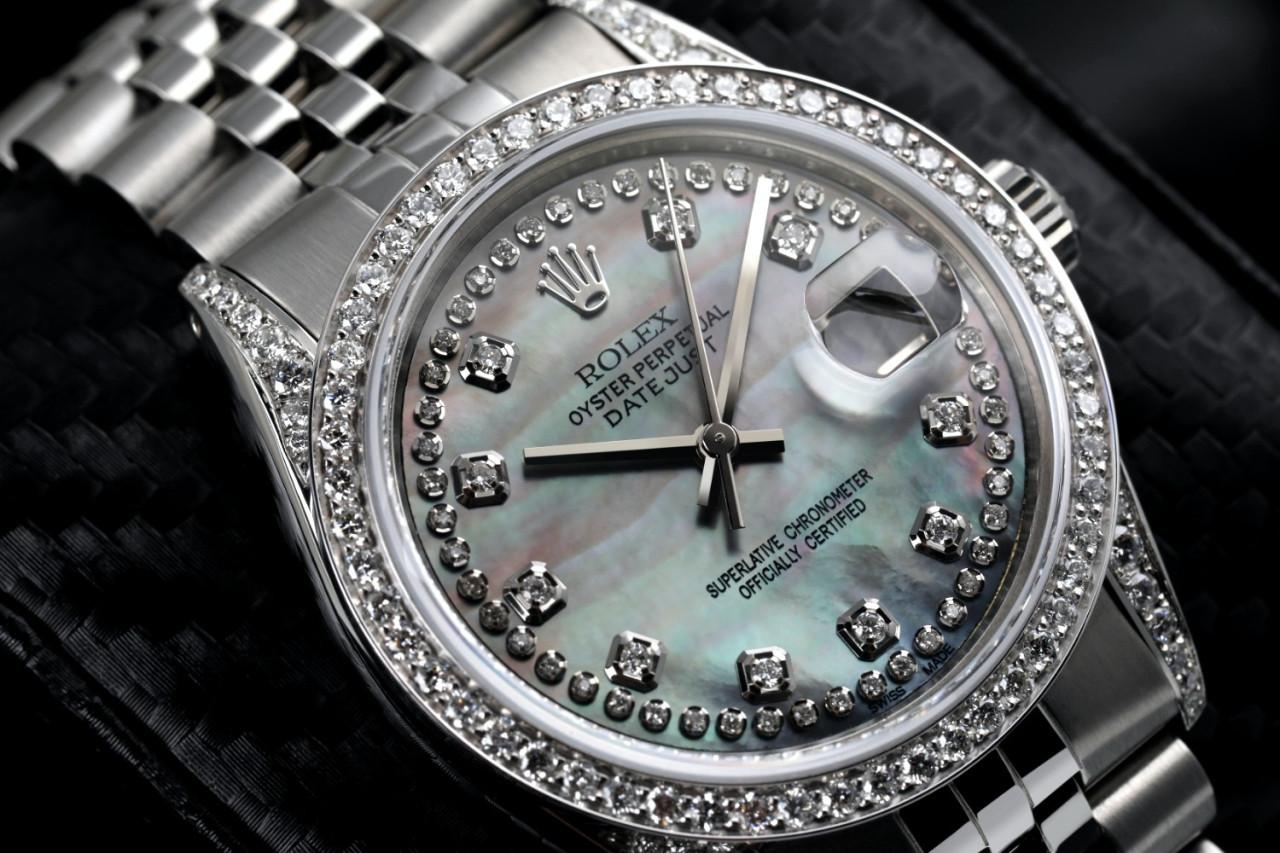 Rolex 36mm Datejust Black Mother of Pearl String Dial Diamond Bezel & Lugs 16030 Watch.
This watch is in like new condition. It has been polished, serviced and has no visible scratches or blemishes. All our watches come with a standard 1 year