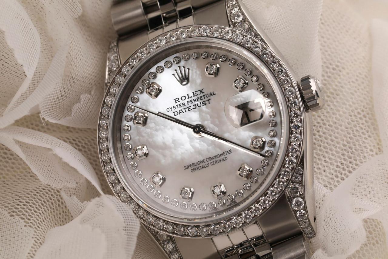 Rolex Datejust 36mm Custom White Mother of Pearl String Diamond Dial, Diamond Bezel and Diamond Lugs.Stainless Steel Watch with Jubilee Band 16014

This watch is in like new condition. It has been polished, serviced and has no visible scratches or